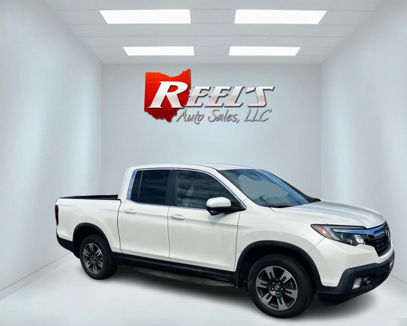 2017 White /Tan Honda Ridgeline RTL-T AWD (5FPYK3F61HB) with an 3.5L V6 SOHC 24V engine, 6-Speed Automatic transmission, located at 11115 Chardon Rd. , Chardon, OH, 44024, (440) 214-9705, 41.580246, -81.241943 - This 2017 Honda Pilot Ridgeline RTL-T AWD is powered by a 3.5 SOHC VTEC V6 engine paired with a 6-speed automatic transmission and offers selectable drive modes. It features LED daytime running lights, tri-zone automatic climate control, and a towing capacity of 5,000 pounds. Safety and convenience - Photo#3