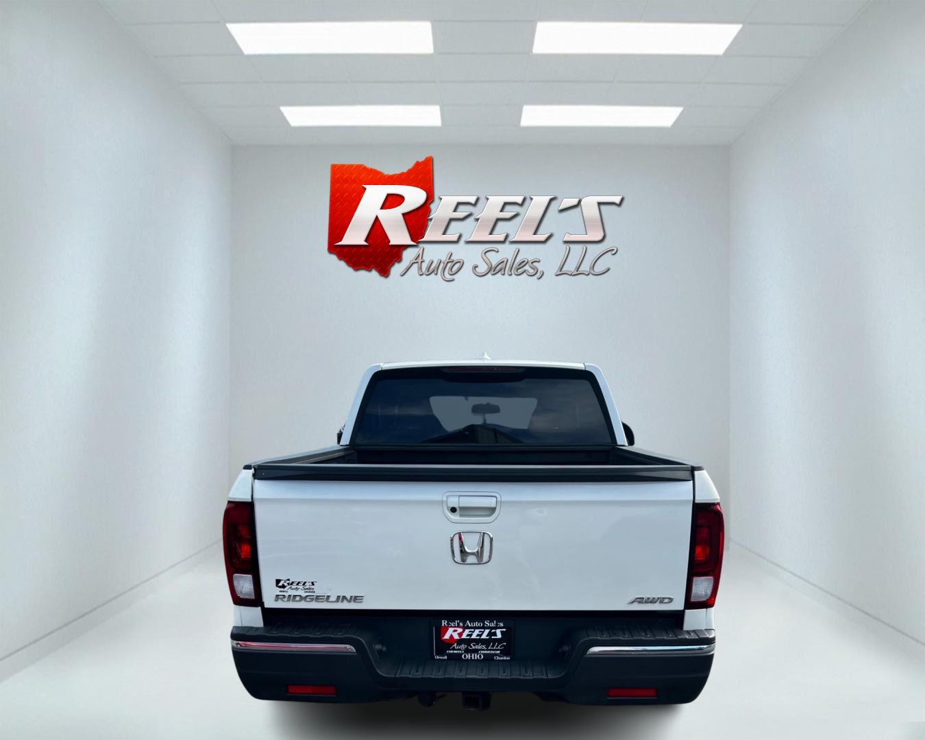 2017 White /Tan Honda Ridgeline RTL-T AWD (5FPYK3F61HB) with an 3.5L V6 SOHC 24V engine, 6-Speed Automatic transmission, located at 11115 Chardon Rd. , Chardon, OH, 44024, (440) 214-9705, 41.580246, -81.241943 - This 2017 Honda Pilot Ridgeline RTL-T AWD is powered by a 3.5 SOHC VTEC V6 engine paired with a 6-speed automatic transmission and offers selectable drive modes. It features LED daytime running lights, tri-zone automatic climate control, and a towing capacity of 5,000 pounds. Safety and convenience - Photo#6