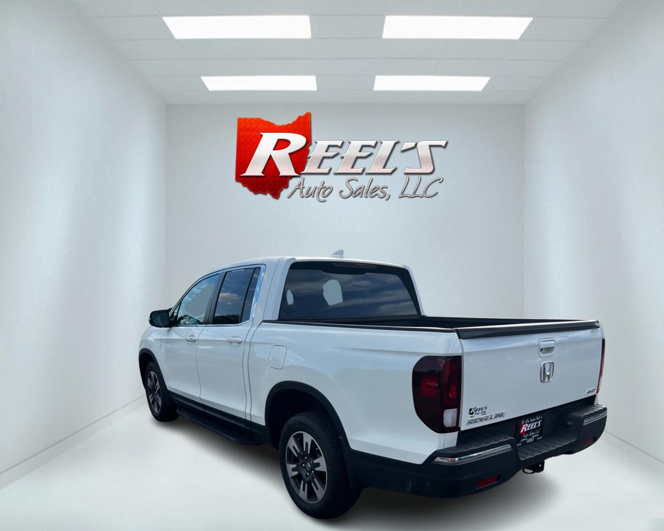 2017 White /Tan Honda Ridgeline RTL-T AWD (5FPYK3F61HB) with an 3.5L V6 SOHC 24V engine, 6-Speed Automatic transmission, located at 11115 Chardon Rd. , Chardon, OH, 44024, (440) 214-9705, 41.580246, -81.241943 - This 2017 Honda Pilot Ridgeline RTL-T AWD is powered by a 3.5 SOHC VTEC V6 engine paired with a 6-speed automatic transmission and offers selectable drive modes. It features LED daytime running lights, tri-zone automatic climate control, and a towing capacity of 5,000 pounds. Safety and convenience - Photo#7