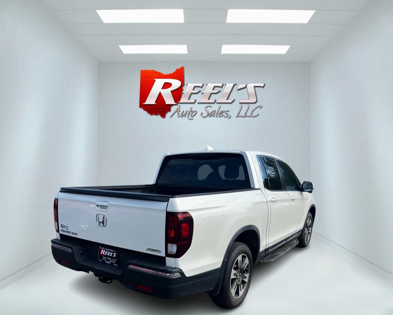 2017 White /Tan Honda Ridgeline RTL-T AWD (5FPYK3F61HB) with an 3.5L V6 SOHC 24V engine, 6-Speed Automatic transmission, located at 11115 Chardon Rd. , Chardon, OH, 44024, (440) 214-9705, 41.580246, -81.241943 - This 2017 Honda Pilot Ridgeline RTL-T AWD is powered by a 3.5 SOHC VTEC V6 engine paired with a 6-speed automatic transmission and offers selectable drive modes. It features LED daytime running lights, tri-zone automatic climate control, and a towing capacity of 5,000 pounds. Safety and convenience - Photo#5