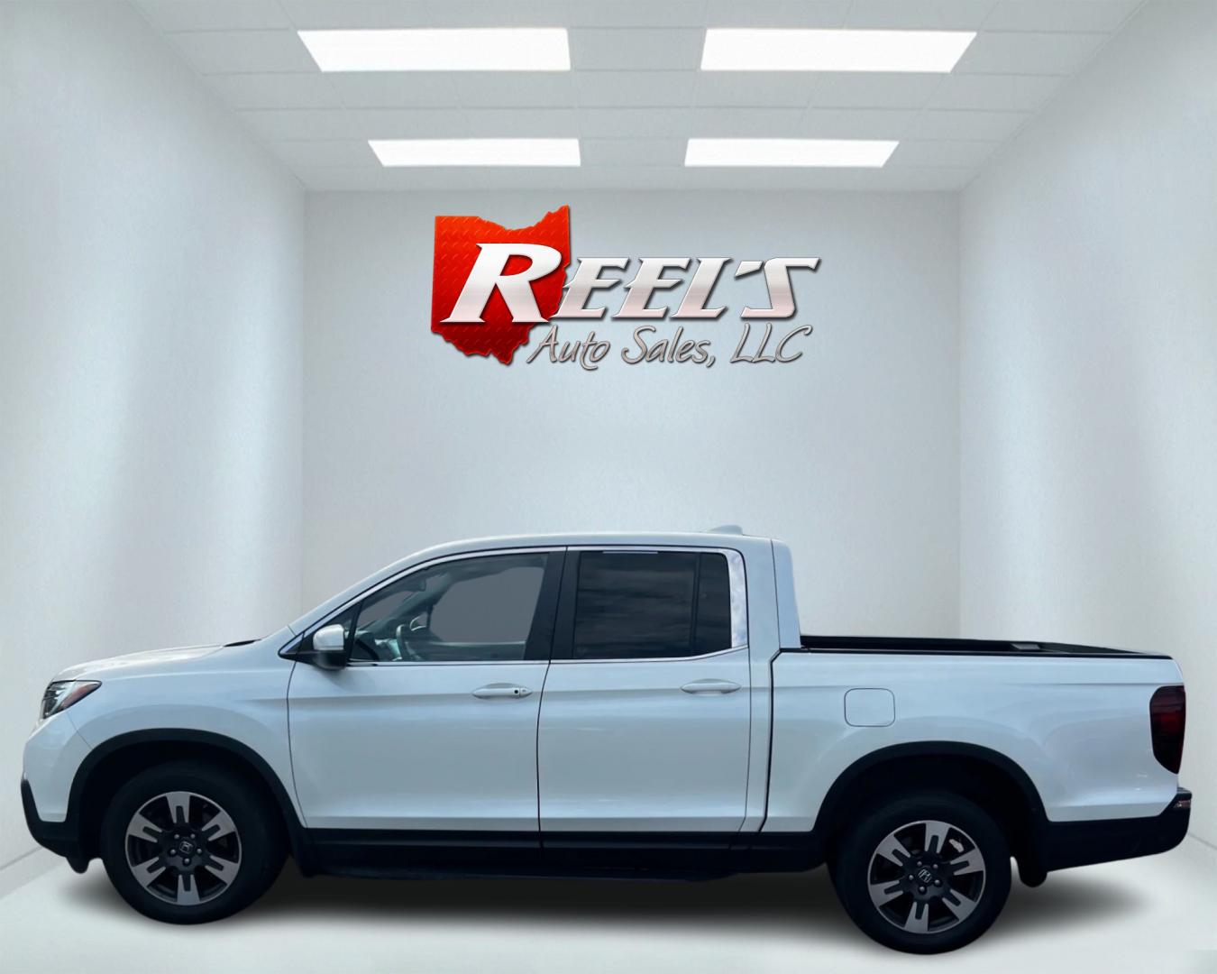 2017 White /Tan Honda Ridgeline RTL-T AWD (5FPYK3F61HB) with an 3.5L V6 SOHC 24V engine, 6-Speed Automatic transmission, located at 11115 Chardon Rd. , Chardon, OH, 44024, (440) 214-9705, 41.580246, -81.241943 - This 2017 Honda Pilot Ridgeline RTL-T AWD is powered by a 3.5 SOHC VTEC V6 engine paired with a 6-speed automatic transmission and offers selectable drive modes. It features LED daytime running lights, tri-zone automatic climate control, and a towing capacity of 5,000 pounds. Safety and convenience - Photo#9