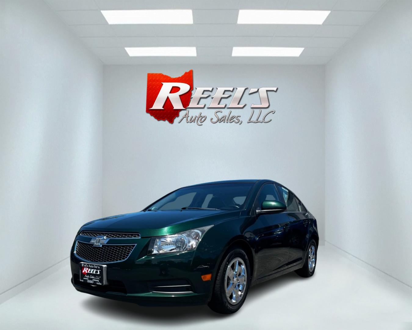 2014 Green /Black Chevrolet Cruze 1LT Auto (1G1PC5SB2E7) with an 1.4L I4 DOHC 16V TURBO engine, 6-Speed Automatic transmission, located at 11115 Chardon Rd. , Chardon, OH, 44024, (440) 214-9705, 41.580246, -81.241943 - This 2014 Chevrolet Cruze 1LT is a compact sedan featuring a 1.4-liter I4 turbocharged EcoTec engine paired with a 6-speed automatic transmission. Highlights include daytime running lights, dusk-sensing headlights, a backup camera, remote start, and a power driver's seat. With an impressive fuel eff - Photo#0