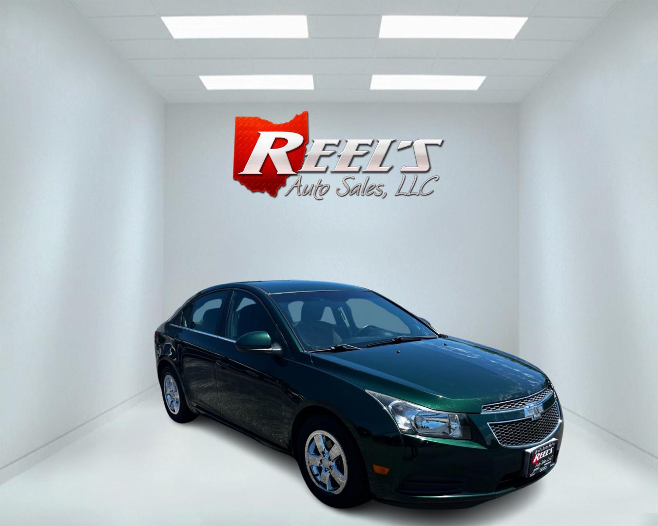 2014 Green /Black Chevrolet Cruze 1LT Auto (1G1PC5SB2E7) with an 1.4L I4 DOHC 16V TURBO engine, 6-Speed Automatic transmission, located at 11115 Chardon Rd. , Chardon, OH, 44024, (440) 214-9705, 41.580246, -81.241943 - This 2014 Chevrolet Cruze 1LT is a compact sedan featuring a 1.4-liter I4 turbocharged EcoTec engine paired with a 6-speed automatic transmission. Highlights include daytime running lights, dusk-sensing headlights, a backup camera, remote start, and a power driver's seat. With an impressive fuel eff - Photo#2