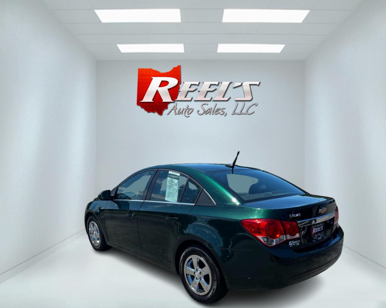 2014 Green /Black Chevrolet Cruze 1LT Auto (1G1PC5SB2E7) with an 1.4L I4 DOHC 16V TURBO engine, 6-Speed Automatic transmission, located at 11115 Chardon Rd. , Chardon, OH, 44024, (440) 214-9705, 41.580246, -81.241943 - This 2014 Chevrolet Cruze 1LT is a compact sedan featuring a 1.4-liter I4 turbocharged EcoTec engine paired with a 6-speed automatic transmission. Highlights include daytime running lights, dusk-sensing headlights, a backup camera, remote start, and a power driver's seat. With an impressive fuel eff - Photo#7