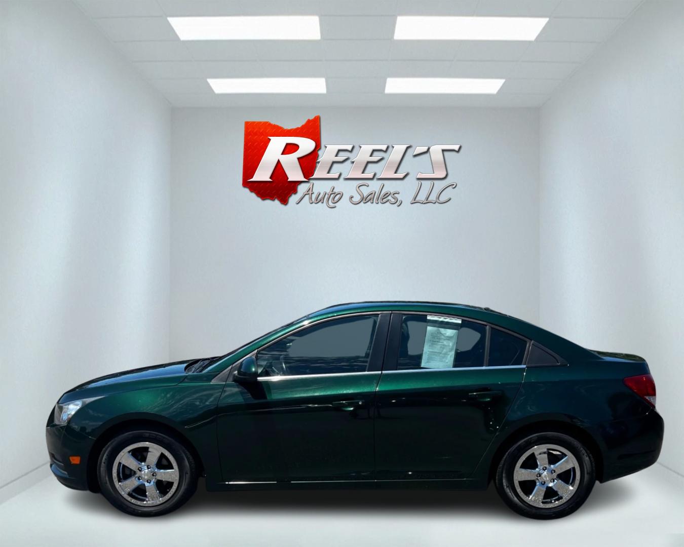 2014 Green /Black Chevrolet Cruze 1LT Auto (1G1PC5SB2E7) with an 1.4L I4 DOHC 16V TURBO engine, 6-Speed Automatic transmission, located at 11115 Chardon Rd. , Chardon, OH, 44024, (440) 214-9705, 41.580246, -81.241943 - This 2014 Chevrolet Cruze 1LT is a compact sedan featuring a 1.4-liter I4 turbocharged EcoTec engine paired with a 6-speed automatic transmission. Highlights include daytime running lights, dusk-sensing headlights, a backup camera, remote start, and a power driver's seat. With an impressive fuel eff - Photo#9