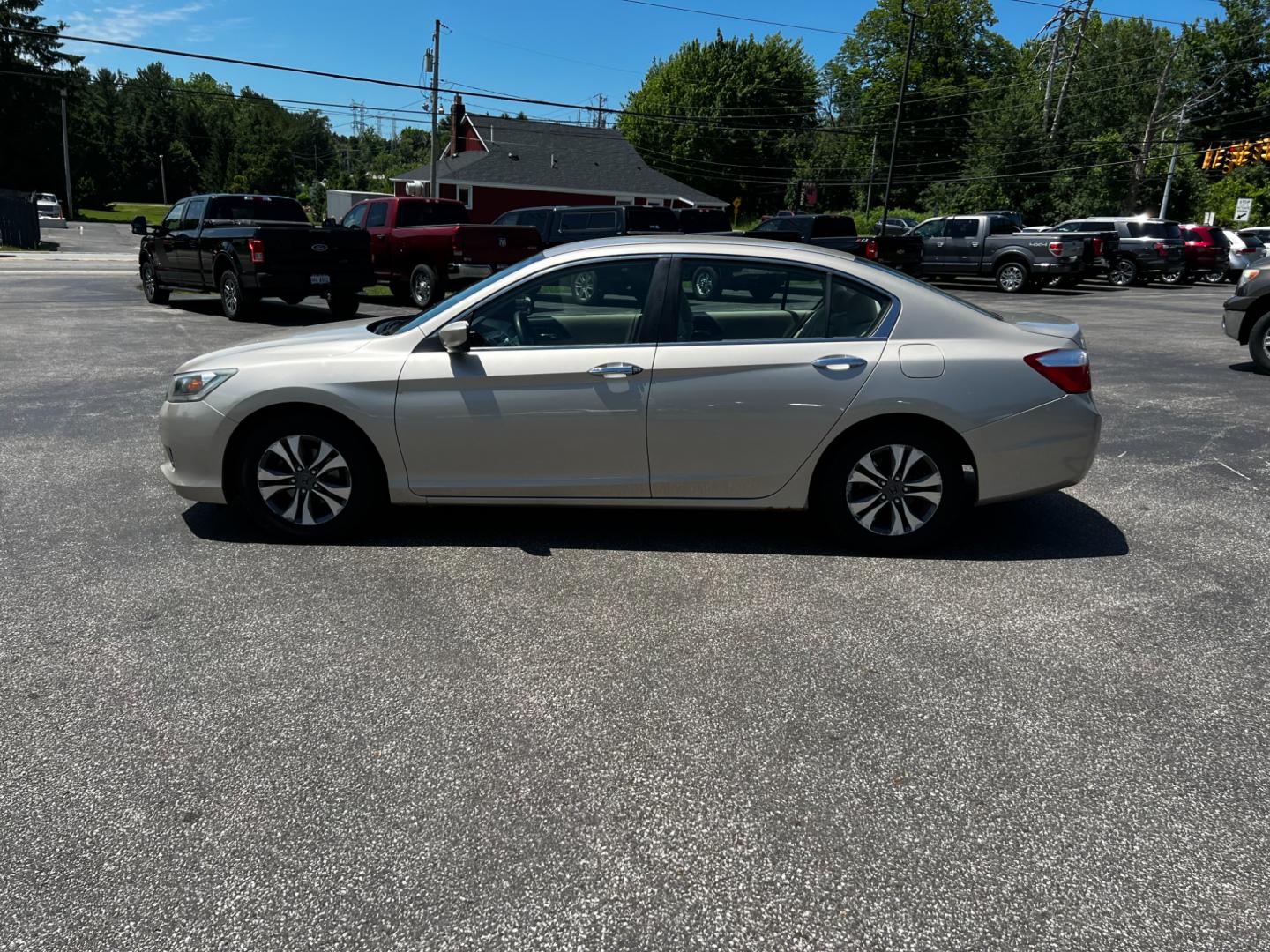 2013 Gold /Tan Honda Accord LX Sedan CVT (1HGCR2F33DA) with an 2.4L I4 DOHC 16V engine, Continuously Variable Transmission transmission, located at 11115 Chardon Rd. , Chardon, OH, 44024, (440) 214-9705, 41.580246, -81.241943 - This 2013 Honda Accord LX is a reliable midsize sedan equipped with a 2.4-liter Earthdreams I4 engine and a CVT transmission, achieving 35 MPG on the highway and currently having 65K miles. Key features include daytime running lights, dusk-sensing headlights, a backup camera, and dual-zone automatic - Photo#13