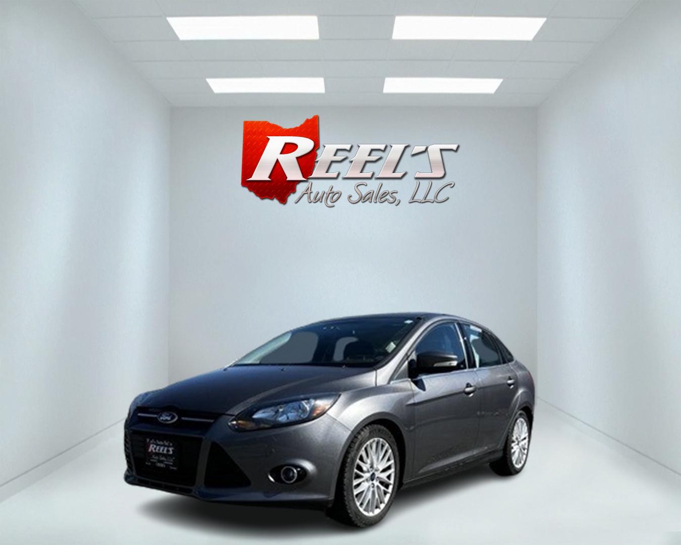 2014 Gray /Black Ford Focus Titanium Sedan (1FADP3J27EL) with an 2.0L I4 DOHC 16V engine, 6-Speed Automatic transmission, located at 11115 Chardon Rd. , Chardon, OH, 44024, (440) 214-9705, 41.580246, -81.241943 - This 2014 Ford Focus Titanium is a well-equipped compact car featuring a 2.0L I4 engine paired with a 6-speed automatic transmission. It boasts a leather interior, backup camera, backup sensors, remote start, dual-zone automatic climate control, and an 8-inch touch screen. Additional highlights incl - Photo#0