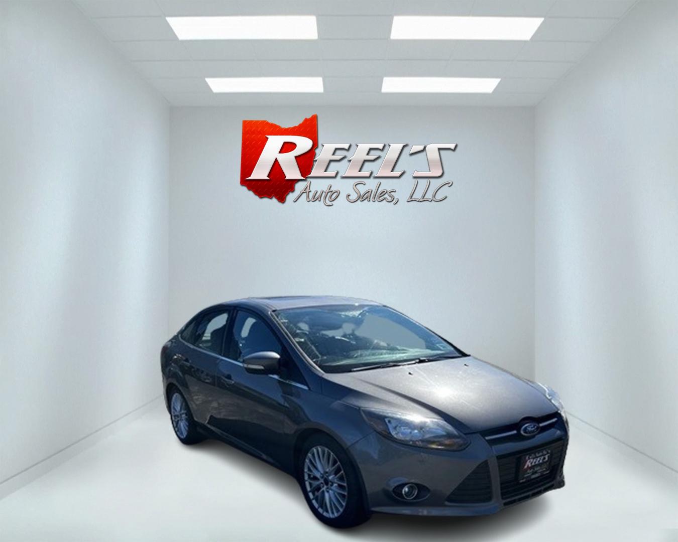 2014 Gray /Black Ford Focus Titanium Sedan (1FADP3J27EL) with an 2.0L I4 DOHC 16V engine, 6-Speed Automatic transmission, located at 11115 Chardon Rd. , Chardon, OH, 44024, (440) 214-9705, 41.580246, -81.241943 - This 2014 Ford Focus Titanium is a well-equipped compact car featuring a 2.0L I4 engine paired with a 6-speed automatic transmission. It boasts a leather interior, backup camera, backup sensors, remote start, dual-zone automatic climate control, and an 8-inch touch screen. Additional highlights incl - Photo#2