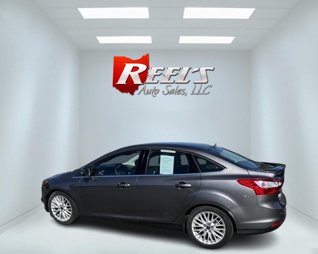 2014 Gray /Black Ford Focus Titanium Sedan (1FADP3J27EL) with an 2.0L I4 DOHC 16V engine, 6-Speed Automatic transmission, located at 11115 Chardon Rd. , Chardon, OH, 44024, (440) 214-9705, 41.580246, -81.241943 - This 2014 Ford Focus Titanium is a well-equipped compact car featuring a 2.0L I4 engine paired with a 6-speed automatic transmission. It boasts a leather interior, backup camera, backup sensors, remote start, dual-zone automatic climate control, and an 8-inch touch screen. Additional highlights incl - Photo#8