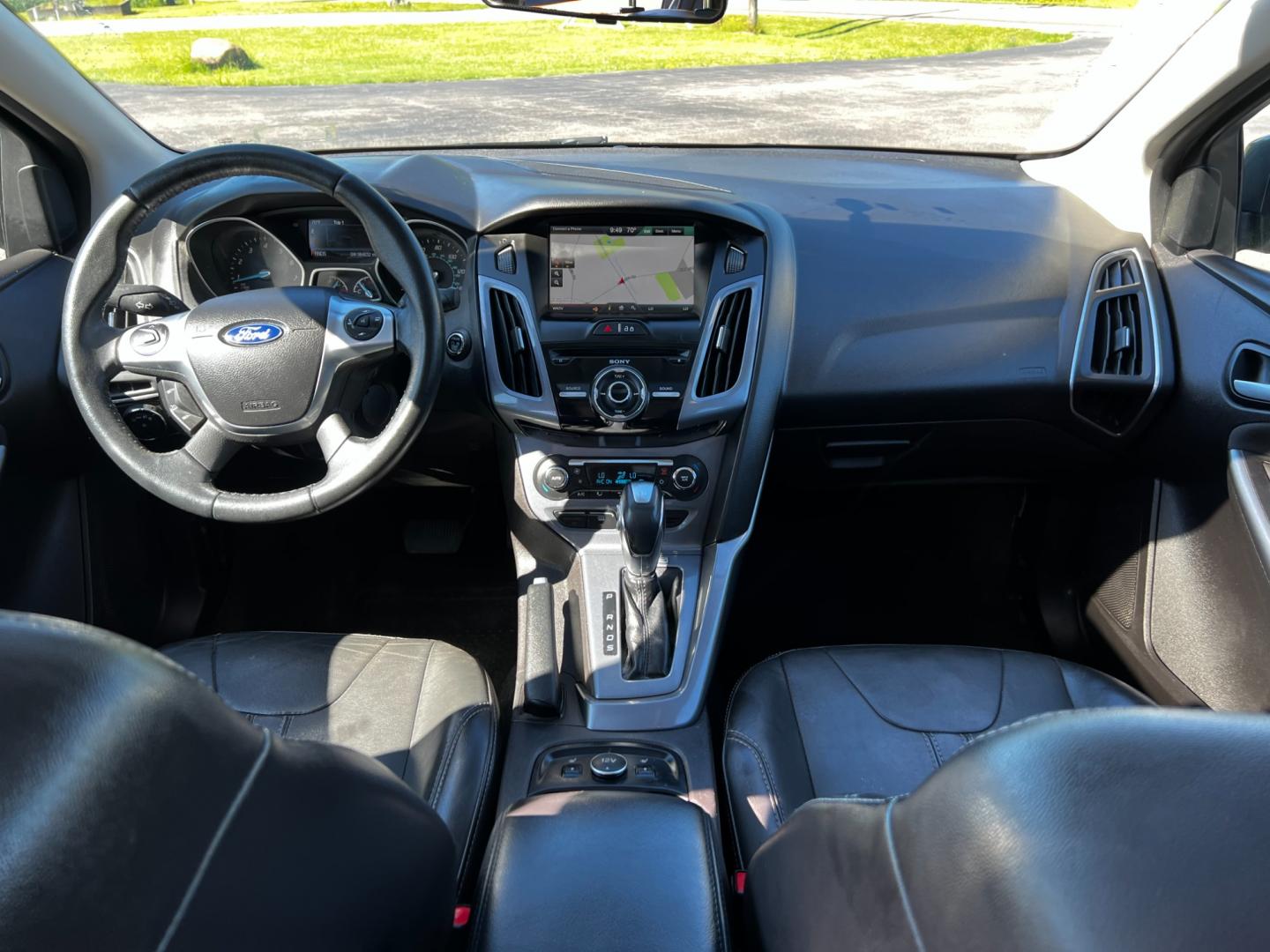 2014 Gray /Black Ford Focus Titanium Sedan (1FADP3J27EL) with an 2.0L I4 DOHC 16V engine, 6-Speed Automatic transmission, located at 11115 Chardon Rd. , Chardon, OH, 44024, (440) 214-9705, 41.580246, -81.241943 - This 2014 Ford Focus Titanium is a well-equipped compact car featuring a 2.0L I4 engine paired with a 6-speed automatic transmission. It boasts a leather interior, backup camera, backup sensors, remote start, dual-zone automatic climate control, and an 8-inch touch screen. Additional highlights incl - Photo#37