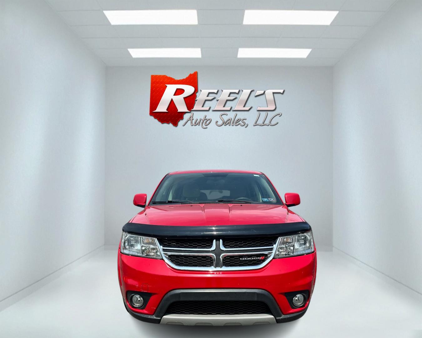 2013 Red /Tan Dodge Journey SXT (3C4PDCBG6DT) with an 3.6L V6 DOHC 24V engine, 6-Speed Automatic transmission, located at 11115 Chardon Rd. , Chardon, OH, 44024, (440) 214-9705, 41.580246, -81.241943 - This 2013 Dodge Journey SXT FWD with a 3.6 Pentastar V6 engine and 6-speed automatic transmission offers a solid blend of performance and practicality. Designed to accommodate seven passengers, it features tri-zone manual climate control to ensure comfort for everyone on board. Key amenities include - Photo#1