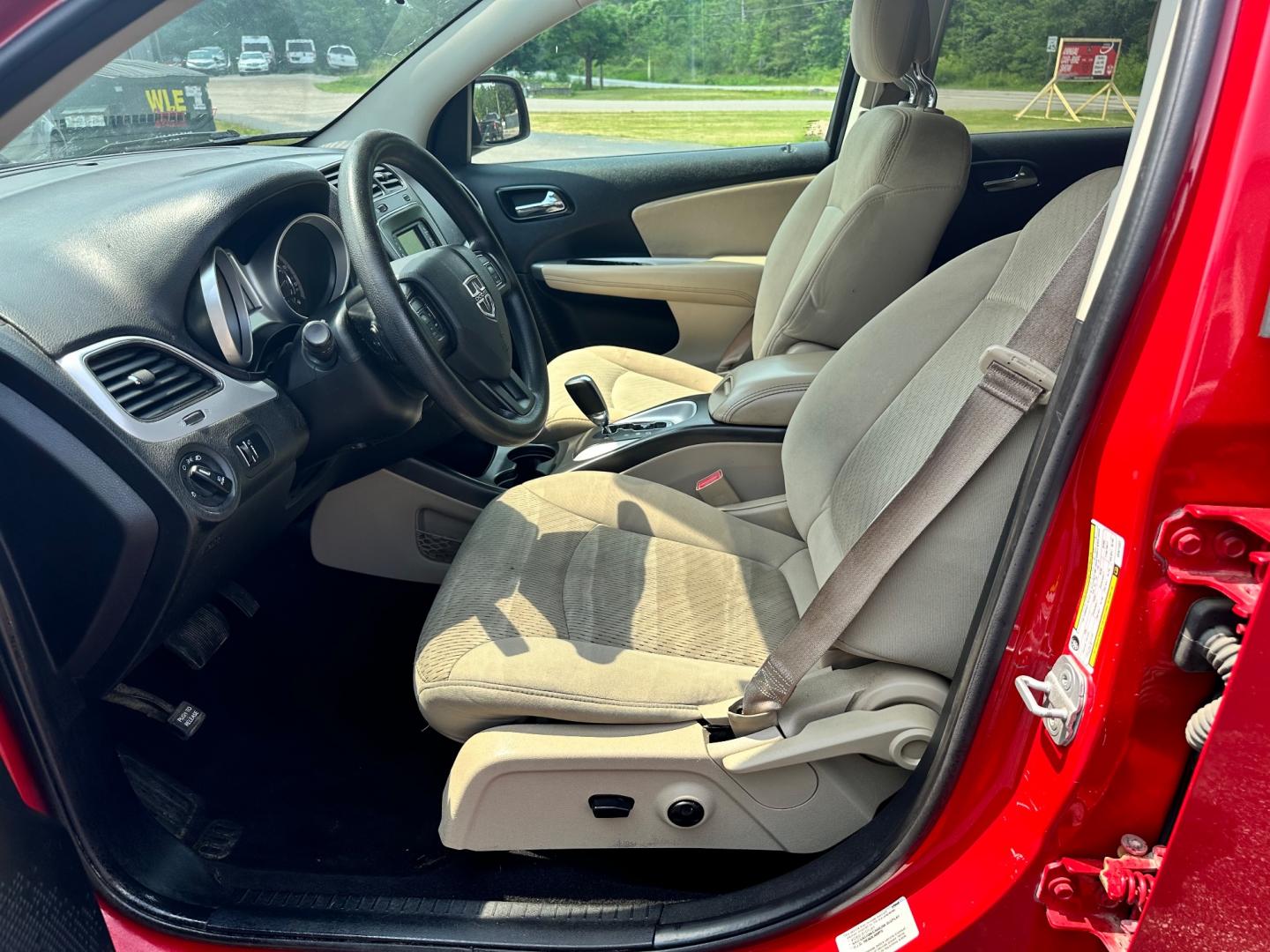 2013 Red /Tan Dodge Journey SXT (3C4PDCBG6DT) with an 3.6L V6 DOHC 24V engine, 6-Speed Automatic transmission, located at 11115 Chardon Rd. , Chardon, OH, 44024, (440) 214-9705, 41.580246, -81.241943 - This 2013 Dodge Journey SXT FWD with a 3.6 Pentastar V6 engine and 6-speed automatic transmission offers a solid blend of performance and practicality. Designed to accommodate seven passengers, it features tri-zone manual climate control to ensure comfort for everyone on board. Key amenities include - Photo#10