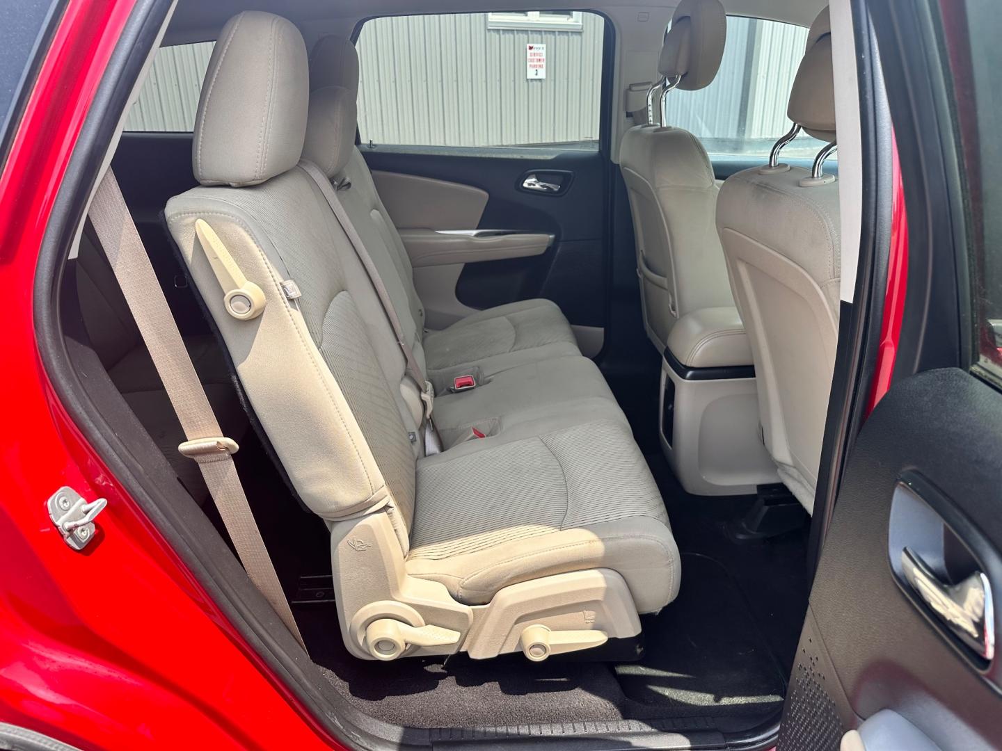 2013 Red /Tan Dodge Journey SXT (3C4PDCBG6DT) with an 3.6L V6 DOHC 24V engine, 6-Speed Automatic transmission, located at 11115 Chardon Rd. , Chardon, OH, 44024, (440) 214-9705, 41.580246, -81.241943 - This 2013 Dodge Journey SXT FWD with a 3.6 Pentastar V6 engine and 6-speed automatic transmission offers a solid blend of performance and practicality. Designed to accommodate seven passengers, it features tri-zone manual climate control to ensure comfort for everyone on board. Key amenities include - Photo#27