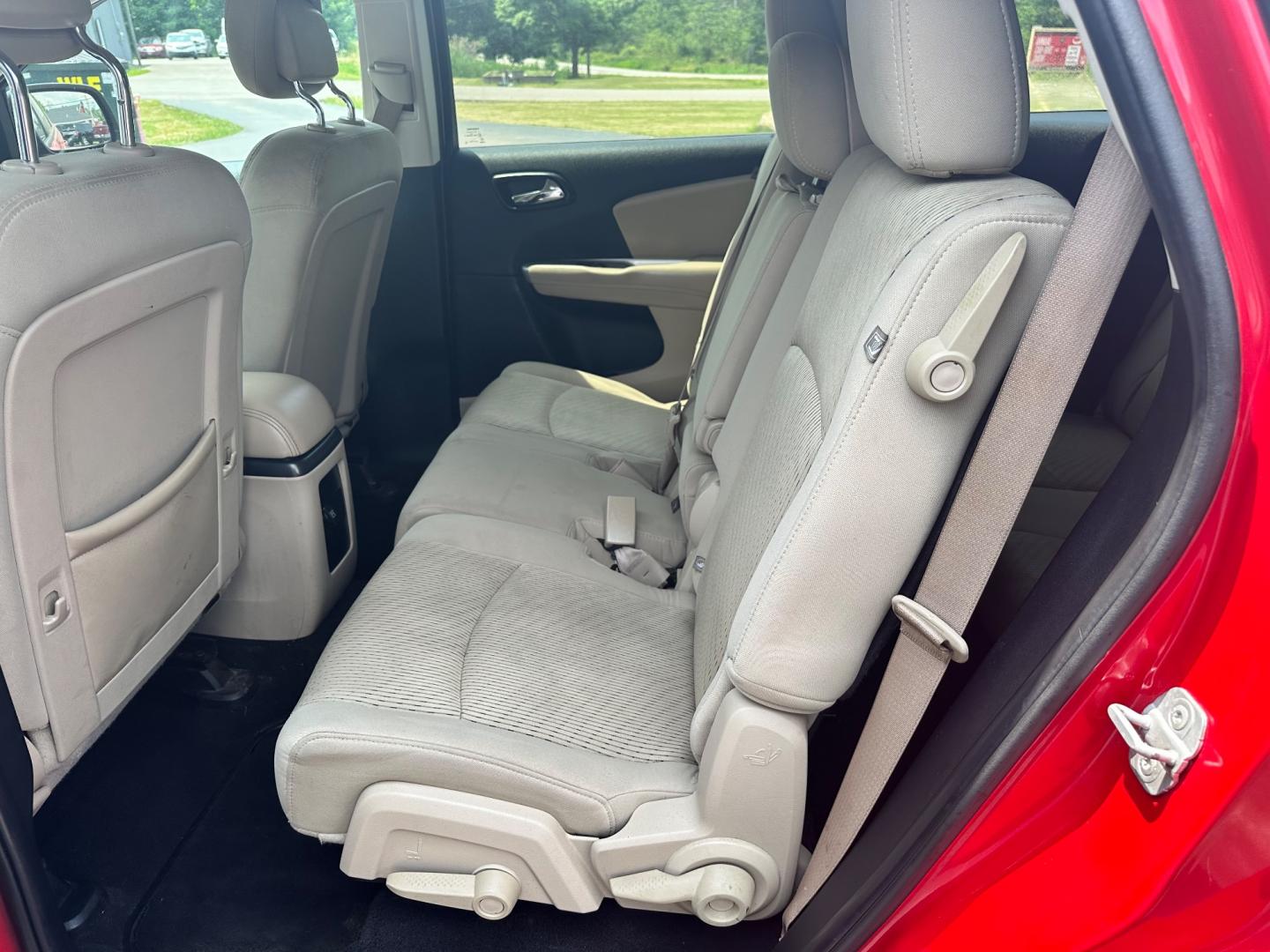 2013 Red /Tan Dodge Journey SXT (3C4PDCBG6DT) with an 3.6L V6 DOHC 24V engine, 6-Speed Automatic transmission, located at 11115 Chardon Rd. , Chardon, OH, 44024, (440) 214-9705, 41.580246, -81.241943 - This 2013 Dodge Journey SXT FWD with a 3.6 Pentastar V6 engine and 6-speed automatic transmission offers a solid blend of performance and practicality. Designed to accommodate seven passengers, it features tri-zone manual climate control to ensure comfort for everyone on board. Key amenities include - Photo#23