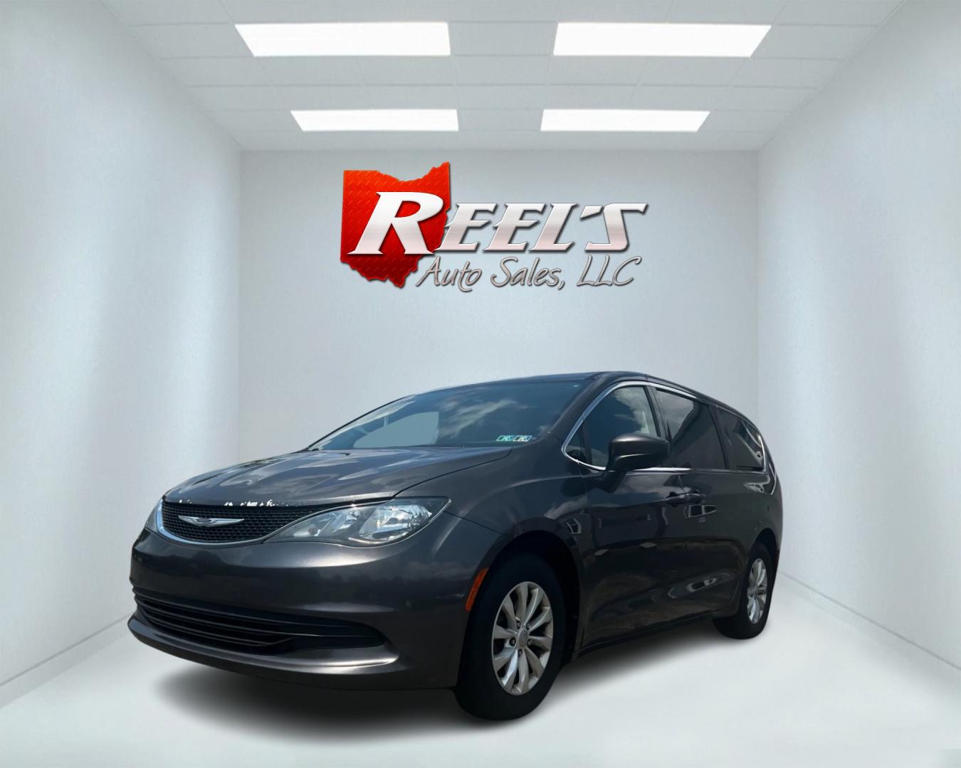 2017 Gray /Black Chrysler Pacifica Touring (2C4RC1DGXHR) with an 3.6L V6 DOHC 24V engine, 9A transmission, located at 547 E. Main St., Orwell, OH, 44076, (440) 437-5893, 41.535435, -80.847855 - This 2017 Chrysler Pacifica Touring is a well-equipped minivan featuring a 3.6L Pentastar V6 engine and a 9-speed automatic transmission, delivering both power and efficiency. It includes modern lighting with LED daytime running lights, LED headlights, and dusk-sensing headlights for enhanced visibi - Photo#0