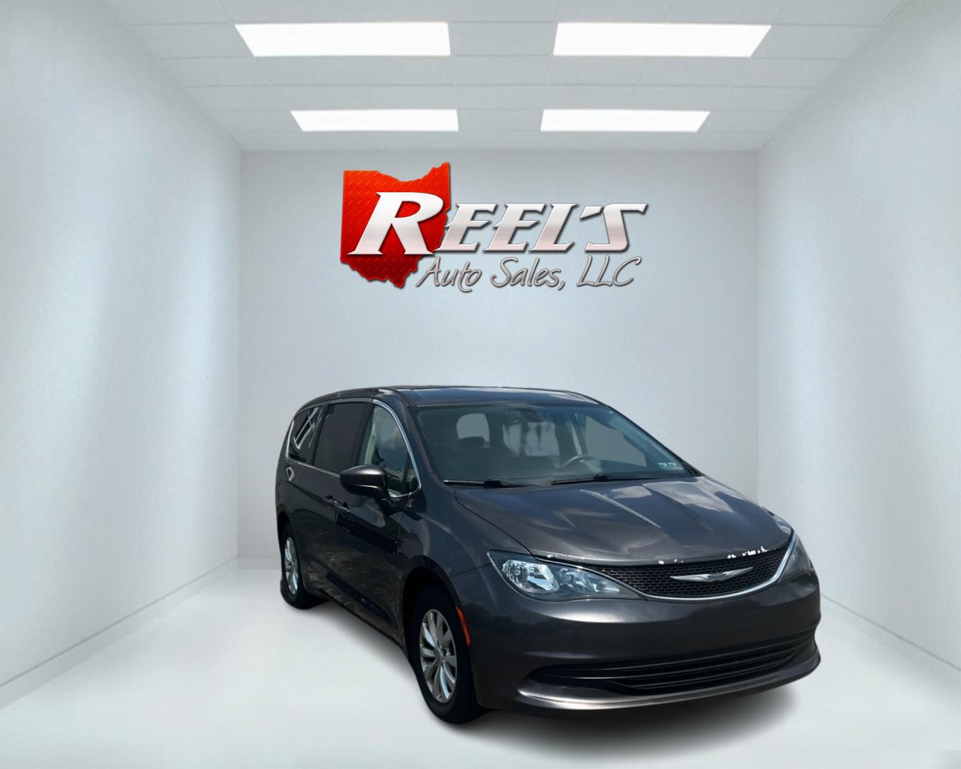 2017 Gray /Black Chrysler Pacifica Touring (2C4RC1DGXHR) with an 3.6L V6 DOHC 24V engine, 9A transmission, located at 547 E. Main St., Orwell, OH, 44076, (440) 437-5893, 41.535435, -80.847855 - This 2017 Chrysler Pacifica Touring is a well-equipped minivan featuring a 3.6L Pentastar V6 engine and a 9-speed automatic transmission, delivering both power and efficiency. It includes modern lighting with LED daytime running lights, LED headlights, and dusk-sensing headlights for enhanced visibi - Photo#2