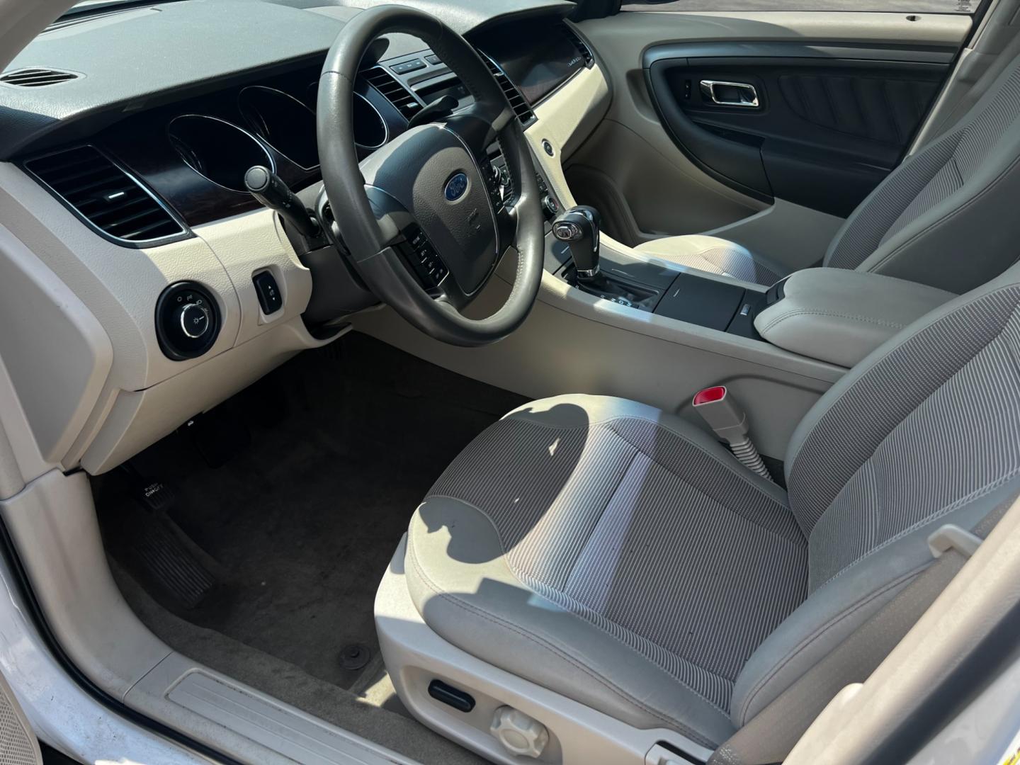 2011 White /Tan Ford Taurus SEL FWD (1FAHP2EWXBG) with an 3.5L V6 DOHC 24V engine, 6 Speed Automatic transmission, located at 11115 Chardon Rd. , Chardon, OH, 44024, (440) 214-9705, 41.580246, -81.241943 - This 2011 Ford Taurus SEL is a reliable and comfortable sedan powered by a 3.5L V6 engine delivering 263 HP, paired with a 6-speed automatic transmission. It offers a range of premium features including a power driver's seat, dual-zone automatic climate control, and backup sensors. For enhanced visi - Photo#16