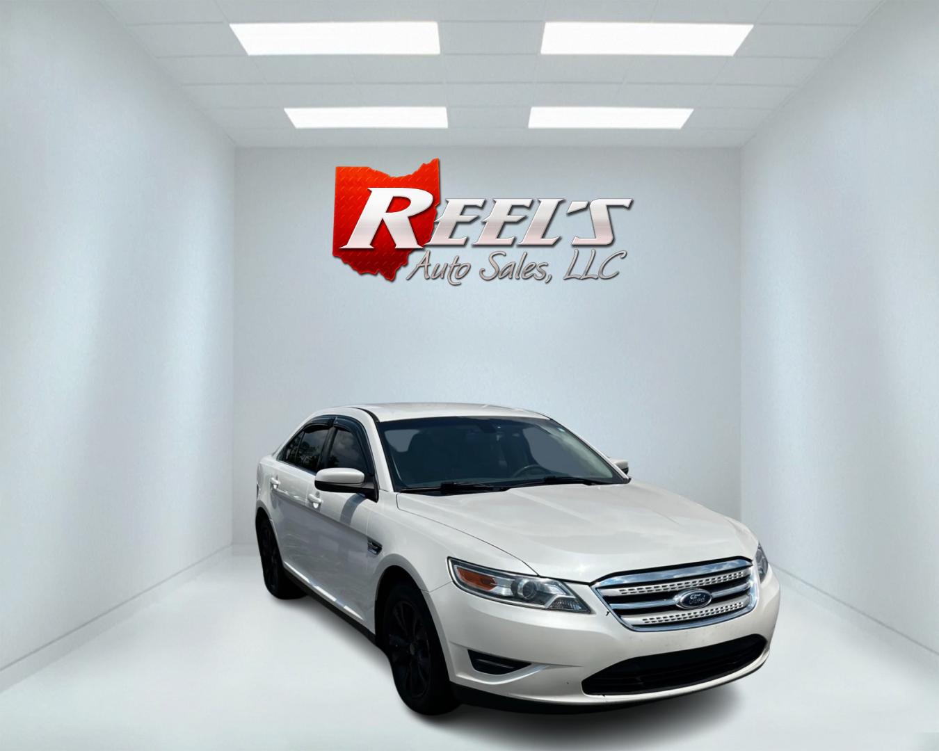 2011 White /Tan Ford Taurus SEL FWD (1FAHP2EWXBG) with an 3.5L V6 DOHC 24V engine, 6 Speed Automatic transmission, located at 11115 Chardon Rd. , Chardon, OH, 44024, (440) 214-9705, 41.580246, -81.241943 - This 2011 Ford Taurus SEL is a reliable and comfortable sedan powered by a 3.5L V6 engine delivering 263 HP, paired with a 6-speed automatic transmission. It offers a range of premium features including a power driver's seat, dual-zone automatic climate control, and backup sensors. For enhanced visi - Photo#2