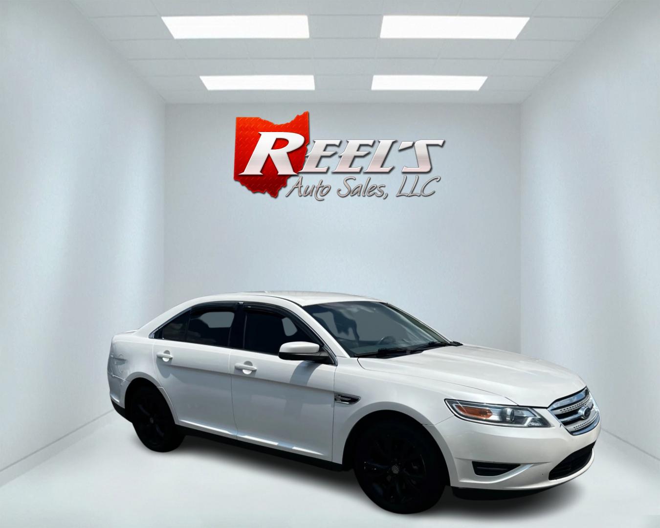 2011 White /Tan Ford Taurus SEL FWD (1FAHP2EWXBG) with an 3.5L V6 DOHC 24V engine, 6 Speed Automatic transmission, located at 11115 Chardon Rd. , Chardon, OH, 44024, (440) 214-9705, 41.580246, -81.241943 - This 2011 Ford Taurus SEL is a reliable and comfortable sedan powered by a 3.5L V6 engine delivering 263 HP, paired with a 6-speed automatic transmission. It offers a range of premium features including a power driver's seat, dual-zone automatic climate control, and backup sensors. For enhanced visi - Photo#3