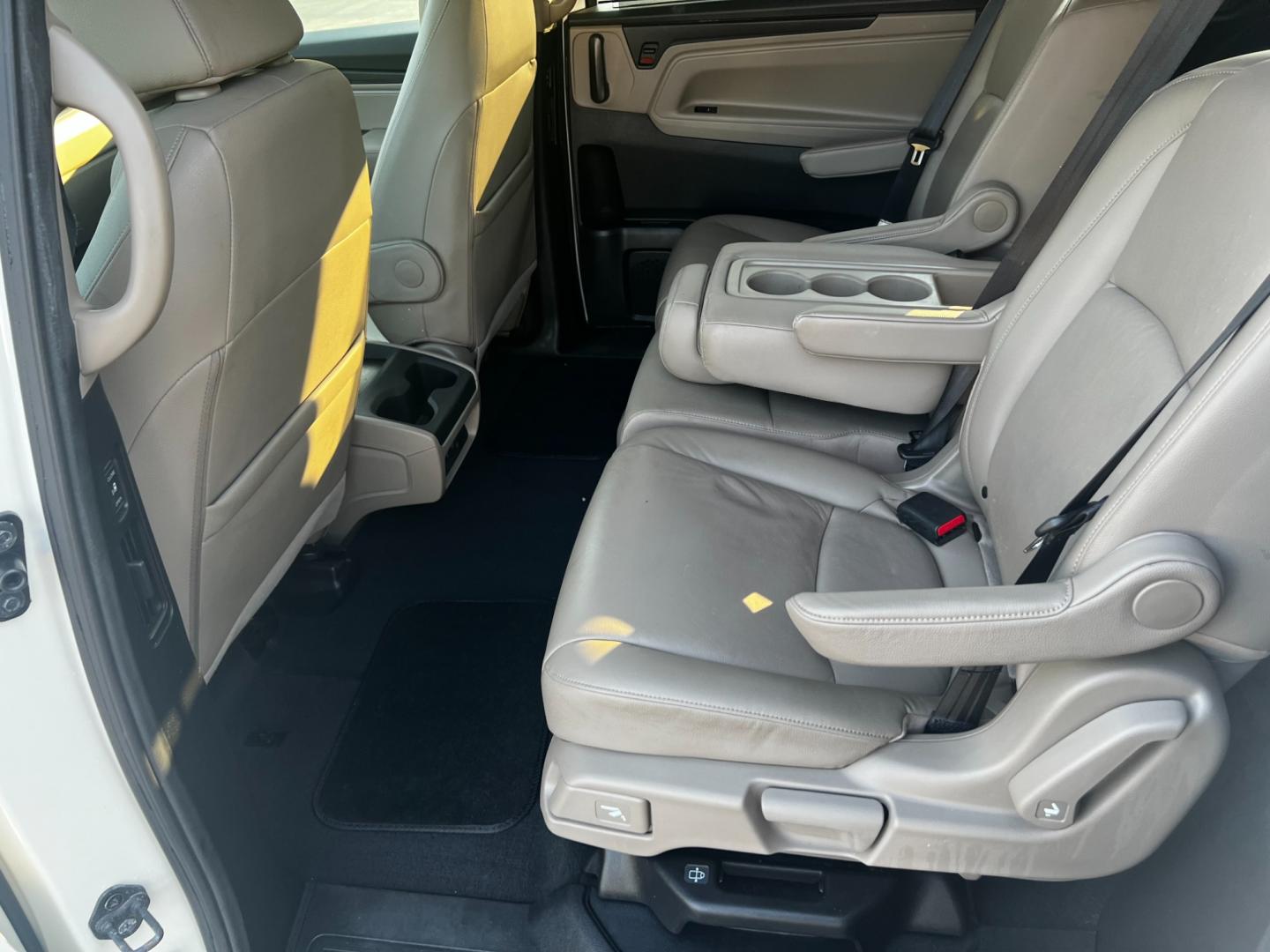 2018 White /Gray Honda Odyssey EXL (5FNRL6H73JB) with an 3.5L V6 SOHC 24V engine, 9-Speed Automatic transmission, located at 547 E. Main St., Orwell, OH, 44076, (440) 437-5893, 41.535435, -80.847855 - This 2018 Honda Odyssey EX-L is a feature-rich minivan powered by a 3.5L Earth Dreams V6 engine and a 9-speed automatic transmission, offering a smooth and efficient drive with 28 MPG on the highway. It boasts a luxurious leather interior, advanced safety features like blind spot monitoring, rear cr - Photo#37