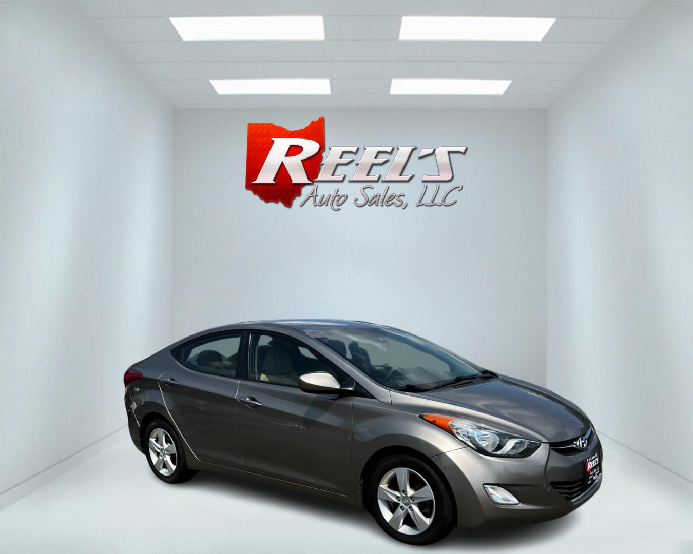 2013 Gold /Tan Hyundai Elantra GLS (5NPDH4AE7DH) with an 1.8L I4 DOHC 16V engine, 6-Speed Automatic transmission, located at 547 E. Main St., Orwell, OH, 44076, (440) 437-5893, 41.535435, -80.847855 - This 2013 Hyundai Elantra GLS Sedan offers a fuel-efficient and practical driving experience with its 1.8L GDI engine and 6-speed automatic transmission, achieving an impressive 38 MPG on the highway. The vehicle is equipped with convenient features such as heated front seats and remote start, ensur - Photo#3