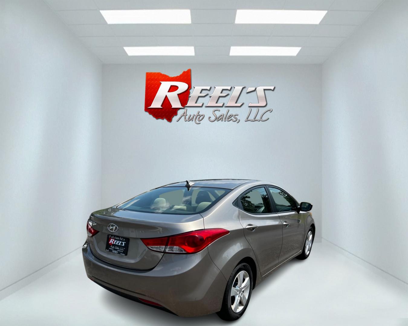 2013 Gold /Tan Hyundai Elantra GLS (5NPDH4AE7DH) with an 1.8L I4 DOHC 16V engine, 6-Speed Automatic transmission, located at 547 E. Main St., Orwell, OH, 44076, (440) 437-5893, 41.535435, -80.847855 - This 2013 Hyundai Elantra GLS Sedan offers a fuel-efficient and practical driving experience with its 1.8L GDI engine and 6-speed automatic transmission, achieving an impressive 38 MPG on the highway. The vehicle is equipped with convenient features such as heated front seats and remote start, ensur - Photo#5