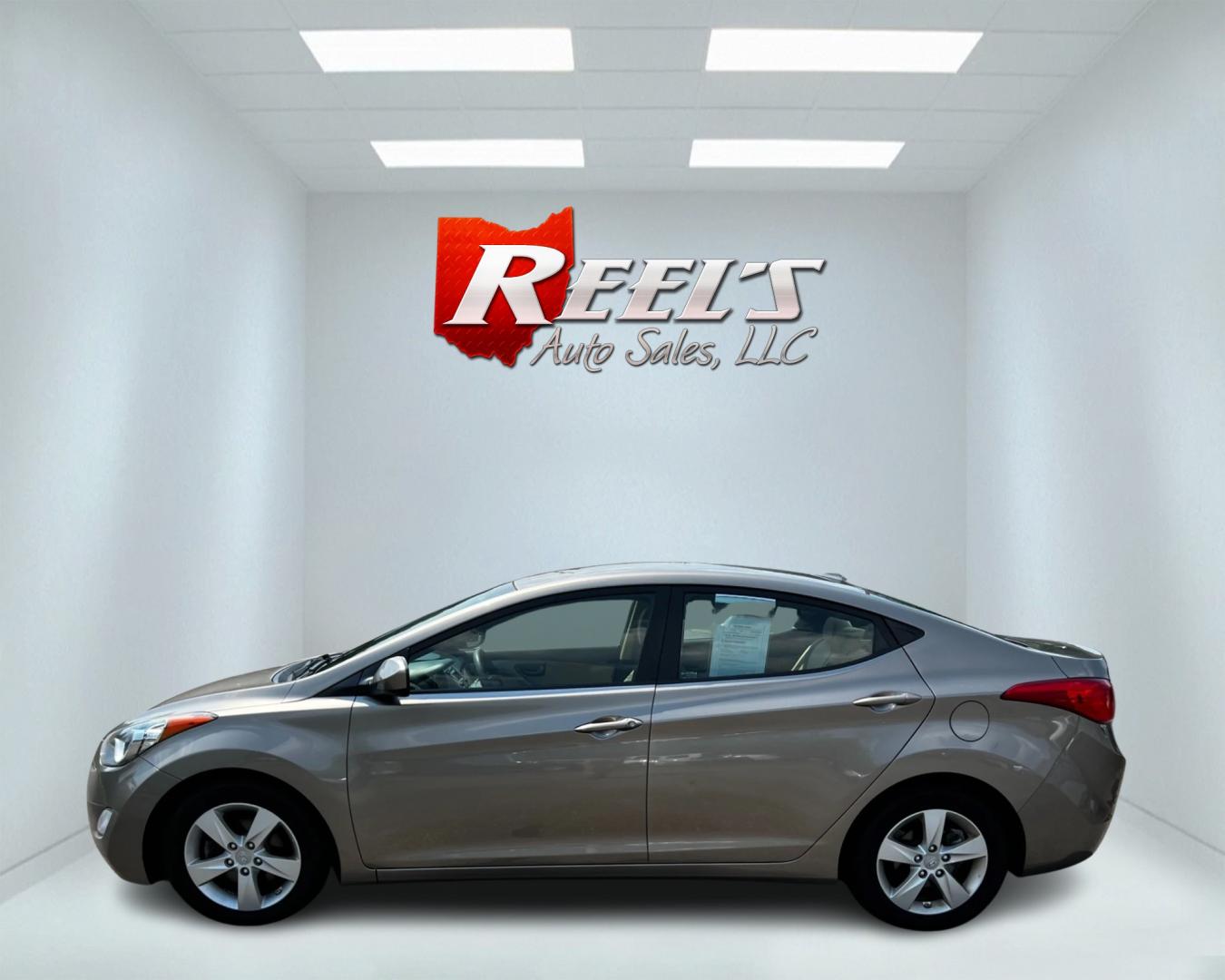 2013 Gold /Tan Hyundai Elantra GLS (5NPDH4AE7DH) with an 1.8L I4 DOHC 16V engine, 6-Speed Automatic transmission, located at 547 E. Main St., Orwell, OH, 44076, (440) 437-5893, 41.535435, -80.847855 - This 2013 Hyundai Elantra GLS Sedan offers a fuel-efficient and practical driving experience with its 1.8L GDI engine and 6-speed automatic transmission, achieving an impressive 38 MPG on the highway. The vehicle is equipped with convenient features such as heated front seats and remote start, ensur - Photo#9