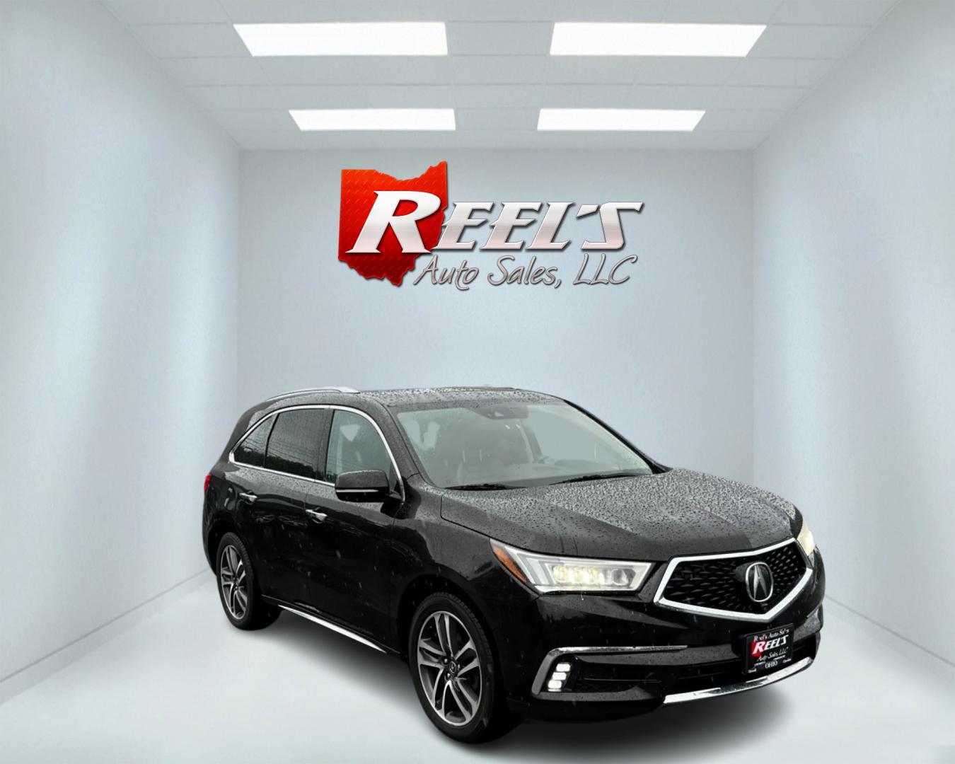 2017 Black /Brown Acura MDX SH-AWD w/Advance and Entertainment (5FRYD4H91HB) with an 3.5L V6 SOHC 24V engine, 9-Speed Automatic transmission, located at 11115 Chardon Rd. , Chardon, OH, 44024, (440) 214-9705, 41.580246, -81.241943 - This 2017 Acura MDX AWD Advance with Entertainment package is a luxurious and well-equipped midsize SUV. It's powered by a 3.5-liter Earth Dreams V6 engine paired with a 9-speed automatic transmission, offering smooth performance and efficiency. The all-wheel-drive system and selectable drive modes - Photo#2