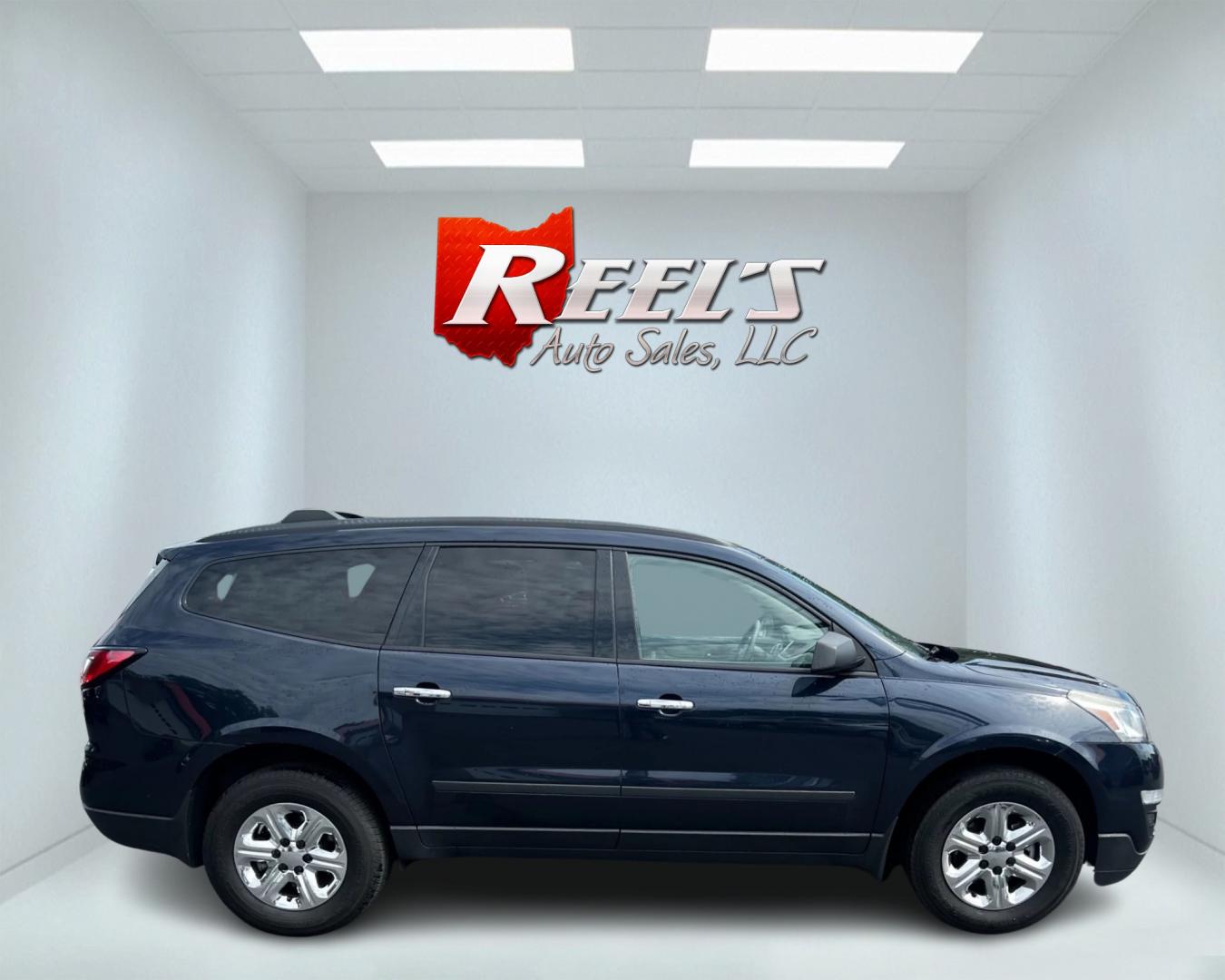 2016 Blue /Gray Chevrolet Traverse LS AWD (1GNKVFKD1GJ) with an 3.6L V6 DOHC 24V engine, 6A transmission, located at 547 E. Main St., Orwell, OH, 44076, (440) 437-5893, 41.535435, -80.847855 - This 2016 Chevrolet Traverse LS AWD is a spacious and capable midsize SUV. It's powered by a robust 3.6-liter V6 engine coupled with a 6-speed automatic transmission, providing ample power for everyday driving and family hauling. The all-wheel-drive system enhances traction and stability in various - Photo#4