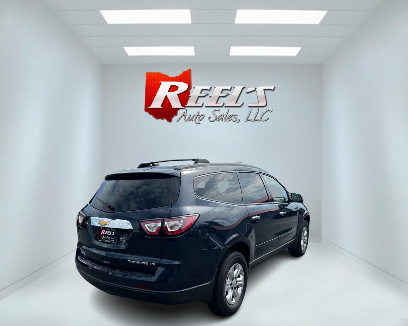 2016 Blue /Gray Chevrolet Traverse LS AWD (1GNKVFKD1GJ) with an 3.6L V6 DOHC 24V engine, 6A transmission, located at 547 E. Main St., Orwell, OH, 44076, (440) 437-5893, 41.535435, -80.847855 - This 2016 Chevrolet Traverse LS AWD is a spacious and capable midsize SUV. It's powered by a robust 3.6-liter V6 engine coupled with a 6-speed automatic transmission, providing ample power for everyday driving and family hauling. The all-wheel-drive system enhances traction and stability in various - Photo#5