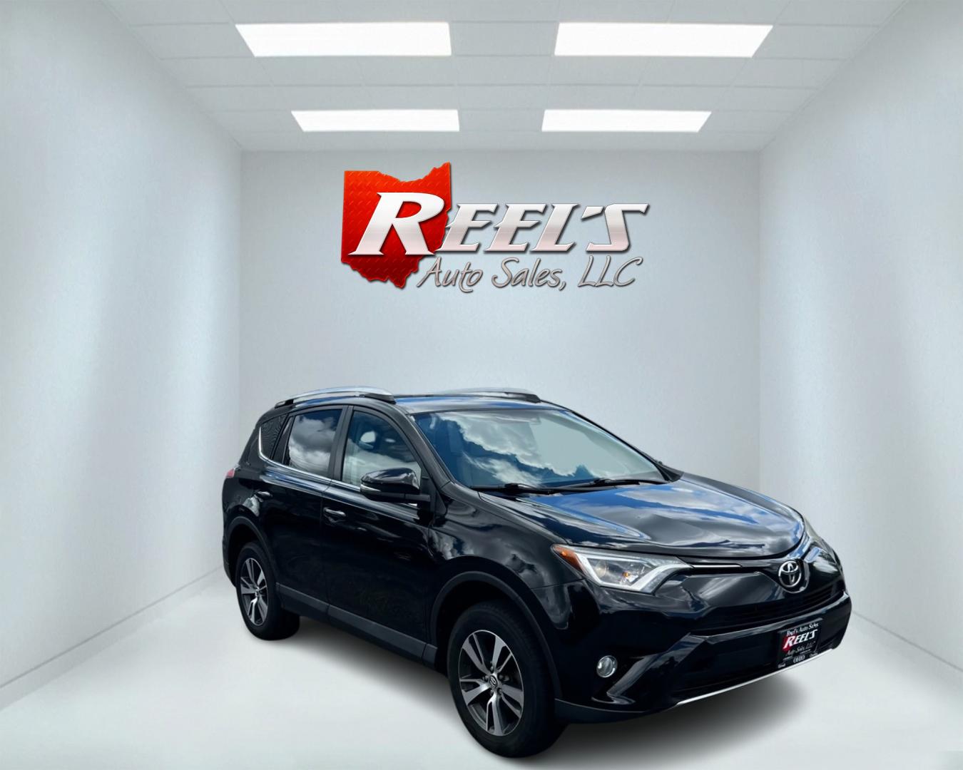 2016 Black /Tan Toyota RAV4 XLE AWD (2T3RFREV5GW) with an 2.5L I4 DOHC 16V engine, 6-Speed Automatic transmission, located at 547 E. Main St., Orwell, OH, 44076, (440) 437-5893, 41.535435, -80.847855 - This 2016 Toyota RAV4 XLE AWD is a practical and well-equipped compact SUV. It features a 2.5-liter 4-cylinder engine paired with a 6-speed automatic transmission, providing reliable performance with all-wheel drive capability. The XLE trim offers a good balance of comfort and features, including du - Photo#2