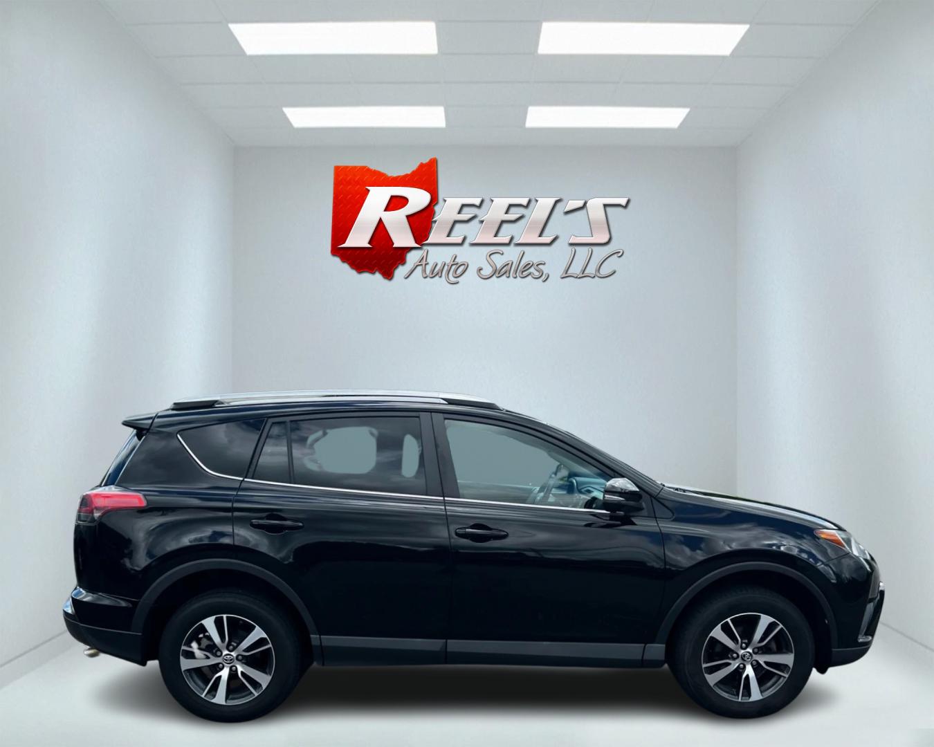 2016 Black /Tan Toyota RAV4 XLE AWD (2T3RFREV5GW) with an 2.5L I4 DOHC 16V engine, 6-Speed Automatic transmission, located at 547 E. Main St., Orwell, OH, 44076, (440) 437-5893, 41.535435, -80.847855 - This 2016 Toyota RAV4 XLE AWD is a practical and well-equipped compact SUV. It features a 2.5-liter 4-cylinder engine paired with a 6-speed automatic transmission, providing reliable performance with all-wheel drive capability. The XLE trim offers a good balance of comfort and features, including du - Photo#4