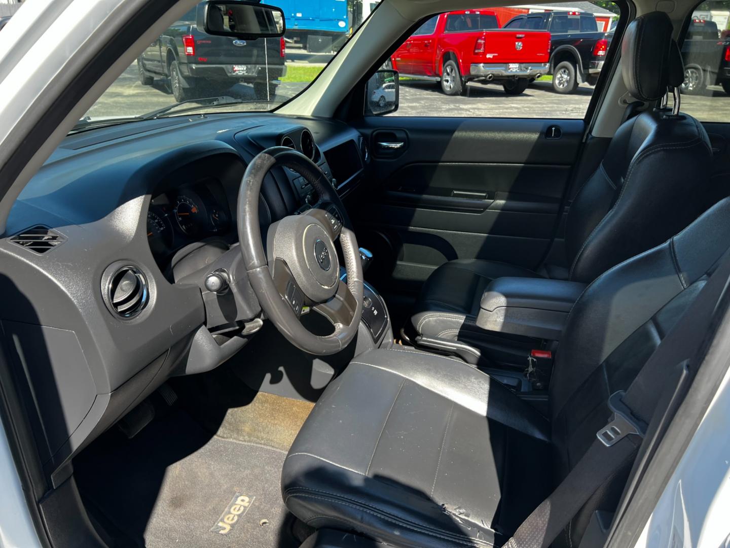 2016 White /Black Jeep Patriot High Altitude 4WD (1C4NJRFB4GD) with an 2.4L I4 DOHC 16V engine, 6-Speed Automatic transmission, located at 11115 Chardon Rd. , Chardon, OH, 44024, (440) 214-9705, 41.580246, -81.241943 - Photo#12