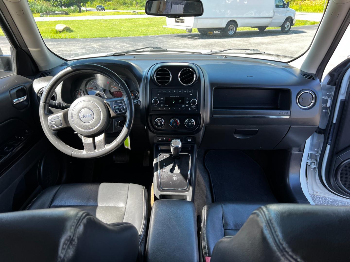 2016 White /Black Jeep Patriot High Altitude 4WD (1C4NJRFB4GD) with an 2.4L I4 DOHC 16V engine, 6-Speed Automatic transmission, located at 11115 Chardon Rd. , Chardon, OH, 44024, (440) 214-9705, 41.580246, -81.241943 - This 2016 Jeep Patriot High Altitude 4WD is a well-equipped compact SUV offering a blend of comfort and capability. It's powered by a 2.4L Multiair engine paired with a 6-speed automatic transmission, providing a balance of performance and efficiency with 26 MPG on the highway. The 4WD system with a - Photo#31