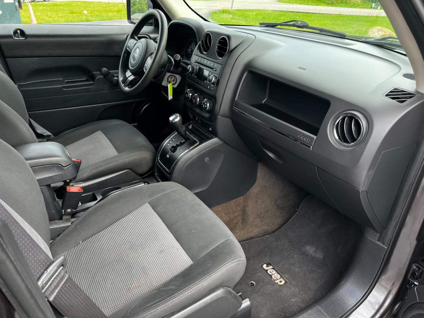 2016 Gray /Black Jeep Patriot Sport 4WD (1C4NJRBB3GD) with an 2.4L I4 DOHC 16V engine, 6-Speed Automatic transmission, located at 11115 Chardon Rd. , Chardon, OH, 44024, (440) 214-9705, 41.580246, -81.241943 - This 2016 Jeep Patriot Sport 4WD is a reliable and rugged vehicle, perfect for those who need a capable off-road companion. Equipped with a 2.4L I4 engine and 6-speed automatic transmission, it offers a smooth ride on both paved roads and rough terrain. The aux audio input allows for easy connection - Photo#31