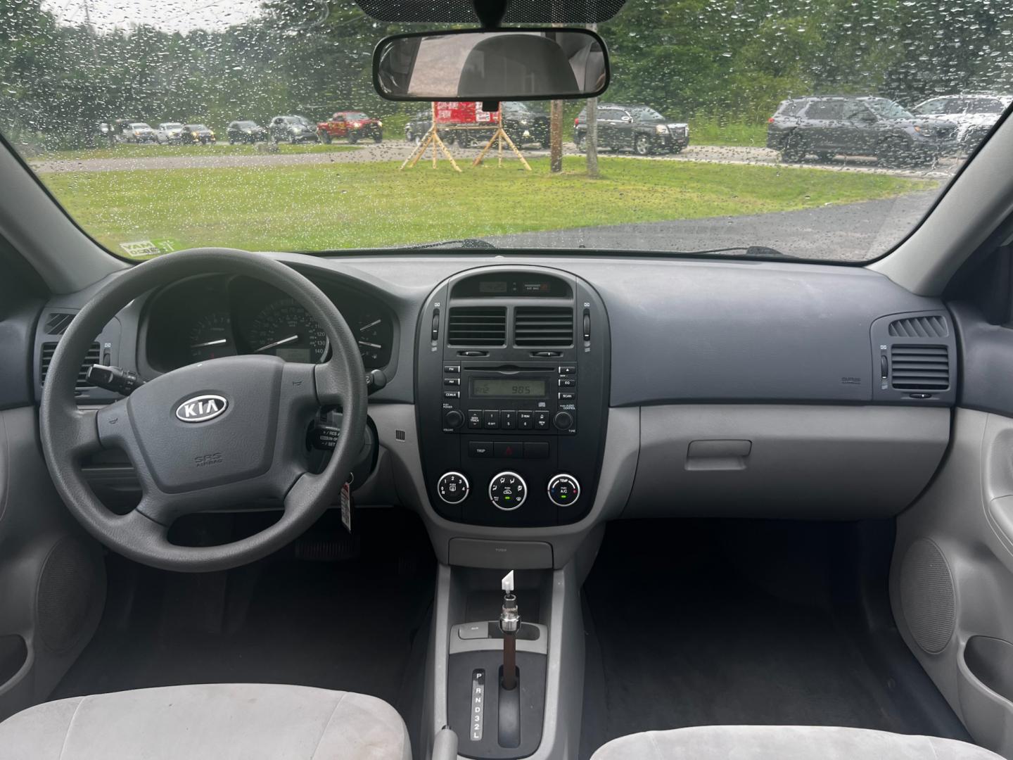 2009 Silver /Gray Kia Spectra EX (KNAFE222995) with an 2.0L I4 DOHC 16V engine, 4 Speed Auto transmission, located at 11115 Chardon Rd. , Chardon, OH, 44024, (440) 214-9705, 41.580246, -81.241943 - This 2009 Kia Spectra EX is a compact sedan that offers a balance of efficiency and practicality. It's equipped with a 2.0-liter inline-four engine paired with a 4-speed automatic transmission, providing a straightforward and reliable powertrain. The Spectra EX stands out for its fuel efficiency, ac - Photo#25