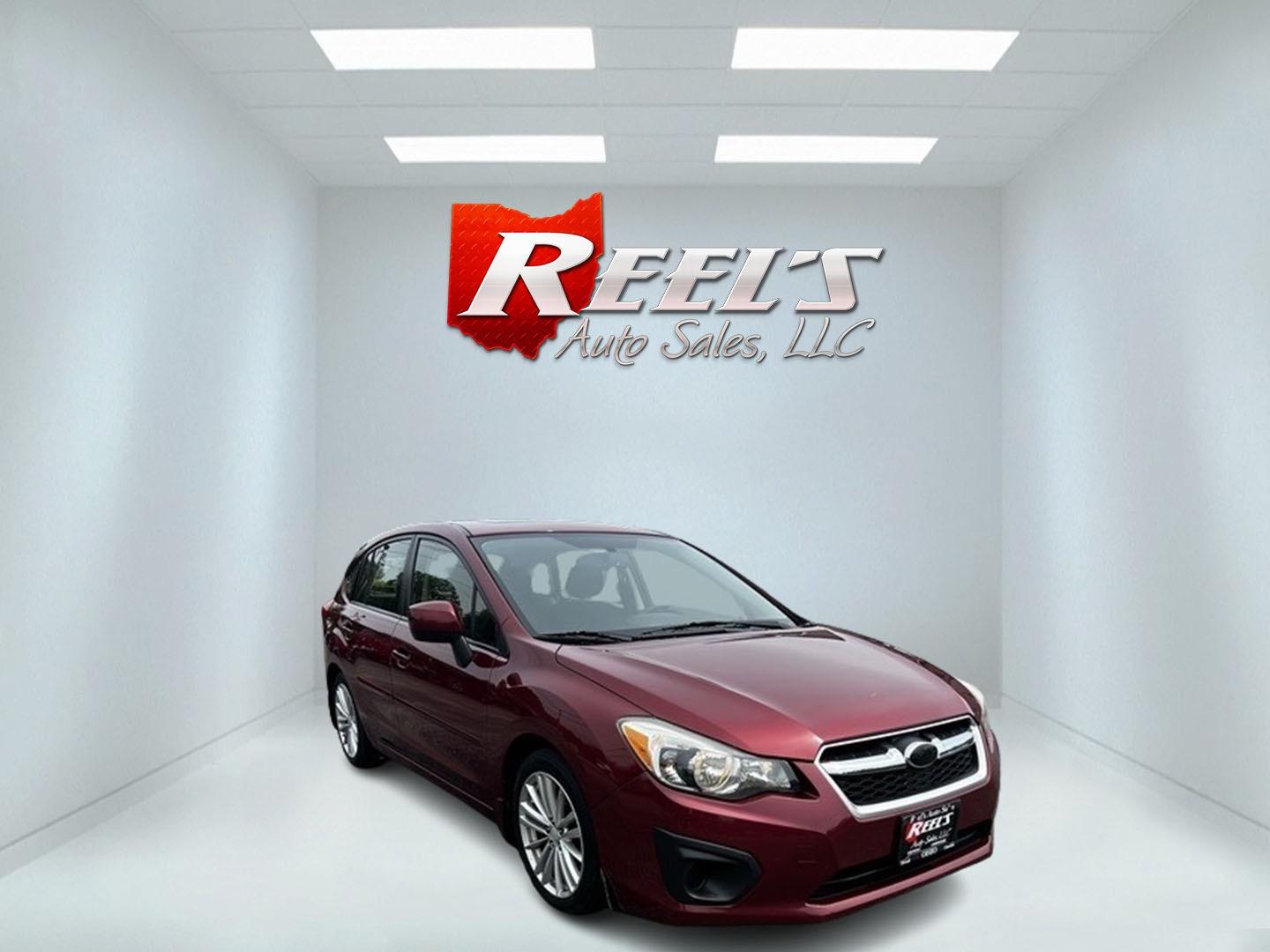 2014 Red /Black Subaru Impreza Premium Plus 5-Door+S/R (JF1GPAD6XE8) with an 2.0L H4 DOHC 16V engine, Automatic transmission, located at 547 E. Main St., Orwell, OH, 44076, (440) 437-5893, 41.535435, -80.847855 - This 2014 Subaru Impreza Premium Plus Wagon is a versatile and efficient compact car that offers a blend of practicality and comfort. It features a 2.0-liter Boxer engine paired with a Continuously Variable Transmission (CVT), delivering smooth performance and excellent fuel economy with up to 36 MP - Photo#2