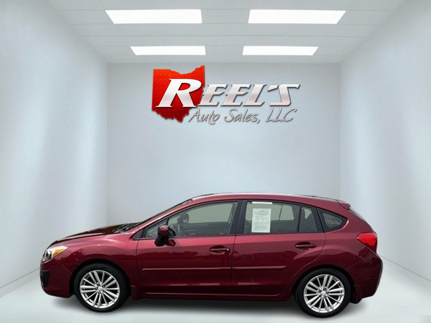 2014 Red /Black Subaru Impreza Premium Plus 5-Door+S/R (JF1GPAD6XE8) with an 2.0L H4 DOHC 16V engine, Automatic transmission, located at 547 E. Main St., Orwell, OH, 44076, (440) 437-5893, 41.535435, -80.847855 - This 2014 Subaru Impreza Premium Plus Wagon is a versatile and efficient compact car that offers a blend of practicality and comfort. It features a 2.0-liter Boxer engine paired with a Continuously Variable Transmission (CVT), delivering smooth performance and excellent fuel economy with up to 36 MP - Photo#9