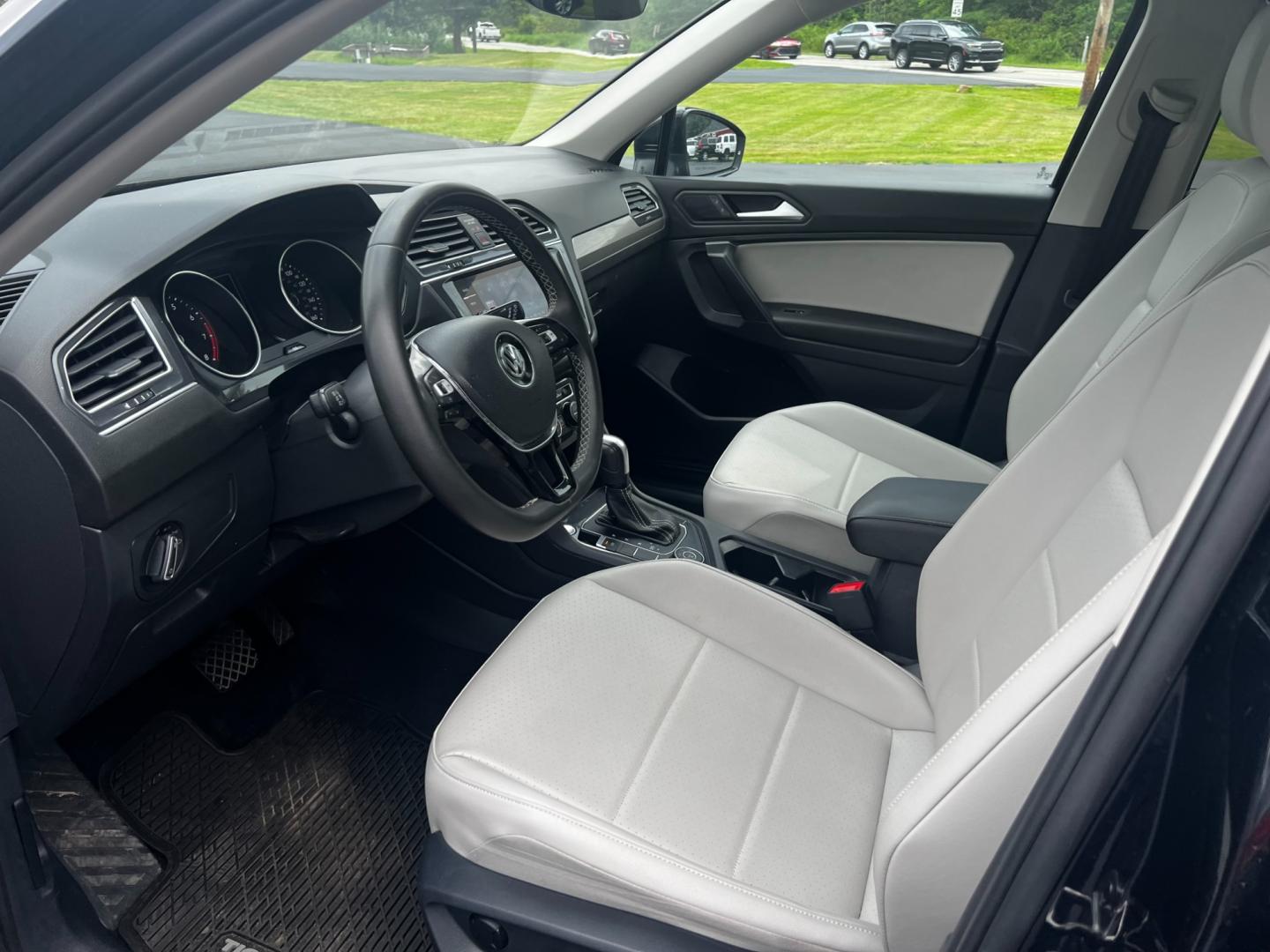 2021 Black /White Volkswagen Tiguan SE 4Motion AWD (3VV2B7AX6MM) with an 2.0L I4 DOHC 16V TURBO engine, 8A transmission, located at 11115 Chardon Rd. , Chardon, OH, 44024, (440) 214-9705, 41.580246, -81.241943 - This 2021 Volkswagen Tiguan SE 4Motion is a well-equipped compact SUV that combines performance, comfort, and advanced technology. It features a 2.0-liter turbocharged four-cylinder engine paired with an 8-speed automatic transmission and all-wheel drive system. This vehicle offers a luxurious inter - Photo#15