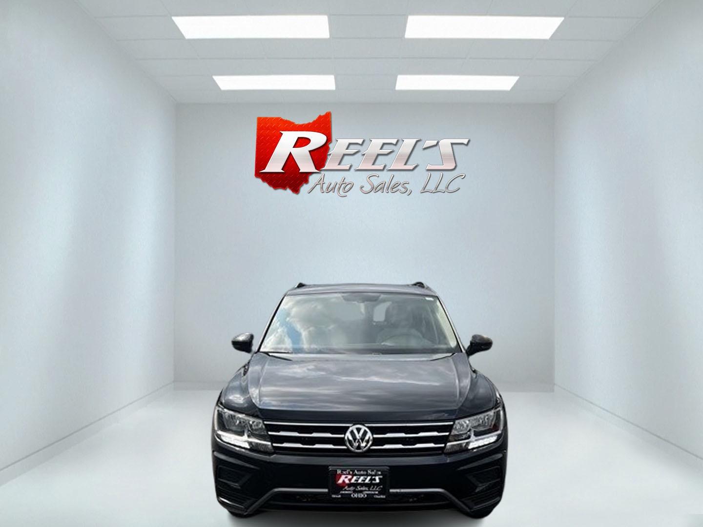 2021 Black /White Volkswagen Tiguan SE 4Motion AWD (3VV2B7AX6MM) with an 2.0L I4 DOHC 16V TURBO engine, 8A transmission, located at 547 E. Main St., Orwell, OH, 44076, (440) 437-5893, 41.535435, -80.847855 - This 2021 Volkswagen Tiguan SE 4Motion is a well-equipped compact SUV that combines performance, comfort, and advanced technology. It features a 2.0-liter turbocharged four-cylinder engine paired with an 8-speed automatic transmission and all-wheel drive system. This vehicle offers a luxurious inter - Photo#1