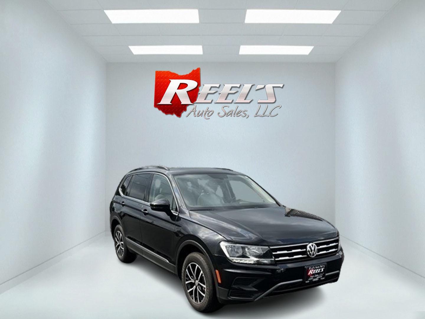 2021 Black /White Volkswagen Tiguan SE 4Motion AWD (3VV2B7AX6MM) with an 2.0L I4 DOHC 16V TURBO engine, 8A transmission, located at 11115 Chardon Rd. , Chardon, OH, 44024, (440) 214-9705, 41.580246, -81.241943 - This 2021 Volkswagen Tiguan SE 4Motion is a well-equipped compact SUV that combines performance, comfort, and advanced technology. It features a 2.0-liter turbocharged four-cylinder engine paired with an 8-speed automatic transmission and all-wheel drive system. This vehicle offers a luxurious inter - Photo#2