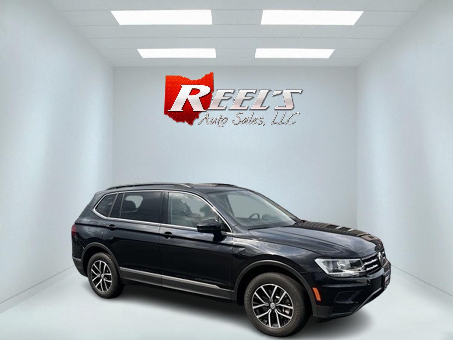 2021 Black /White Volkswagen Tiguan SE 4Motion AWD (3VV2B7AX6MM) with an 2.0L I4 DOHC 16V TURBO engine, 8A transmission, located at 11115 Chardon Rd. , Chardon, OH, 44024, (440) 214-9705, 41.580246, -81.241943 - This 2021 Volkswagen Tiguan SE 4Motion is a well-equipped compact SUV that combines performance, comfort, and advanced technology. It features a 2.0-liter turbocharged four-cylinder engine paired with an 8-speed automatic transmission and all-wheel drive system. This vehicle offers a luxurious inter - Photo#3