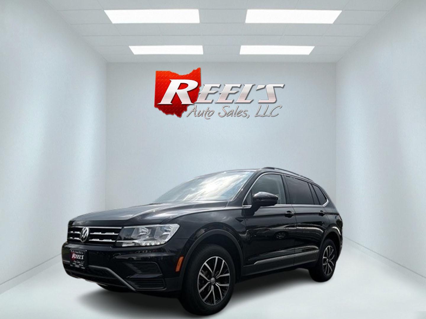 2021 Black /White Volkswagen Tiguan SE 4Motion AWD (3VV2B7AX6MM) with an 2.0L I4 DOHC 16V TURBO engine, 8A transmission, located at 547 E. Main St., Orwell, OH, 44076, (440) 437-5893, 41.535435, -80.847855 - This 2021 Volkswagen Tiguan SE 4Motion is a well-equipped compact SUV that combines performance, comfort, and advanced technology. It features a 2.0-liter turbocharged four-cylinder engine paired with an 8-speed automatic transmission and all-wheel drive system. This vehicle offers a luxurious inter - Photo#0