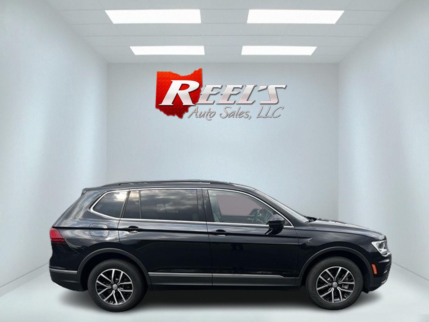 2021 Black /White Volkswagen Tiguan SE 4Motion AWD (3VV2B7AX6MM) with an 2.0L I4 DOHC 16V TURBO engine, 8A transmission, located at 547 E. Main St., Orwell, OH, 44076, (440) 437-5893, 41.535435, -80.847855 - This 2021 Volkswagen Tiguan SE 4Motion is a well-equipped compact SUV that combines performance, comfort, and advanced technology. It features a 2.0-liter turbocharged four-cylinder engine paired with an 8-speed automatic transmission and all-wheel drive system. This vehicle offers a luxurious inter - Photo#4