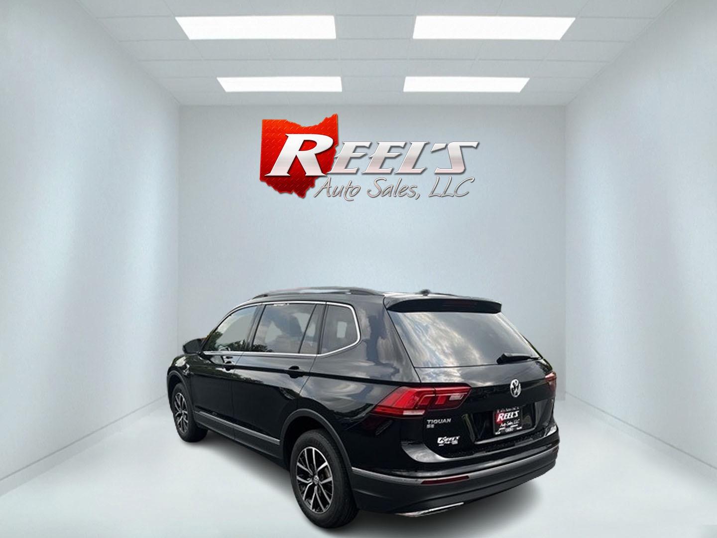 2021 Black /White Volkswagen Tiguan SE 4Motion AWD (3VV2B7AX6MM) with an 2.0L I4 DOHC 16V TURBO engine, 8A transmission, located at 547 E. Main St., Orwell, OH, 44076, (440) 437-5893, 41.535435, -80.847855 - This 2021 Volkswagen Tiguan SE 4Motion is a well-equipped compact SUV that combines performance, comfort, and advanced technology. It features a 2.0-liter turbocharged four-cylinder engine paired with an 8-speed automatic transmission and all-wheel drive system. This vehicle offers a luxurious inter - Photo#7