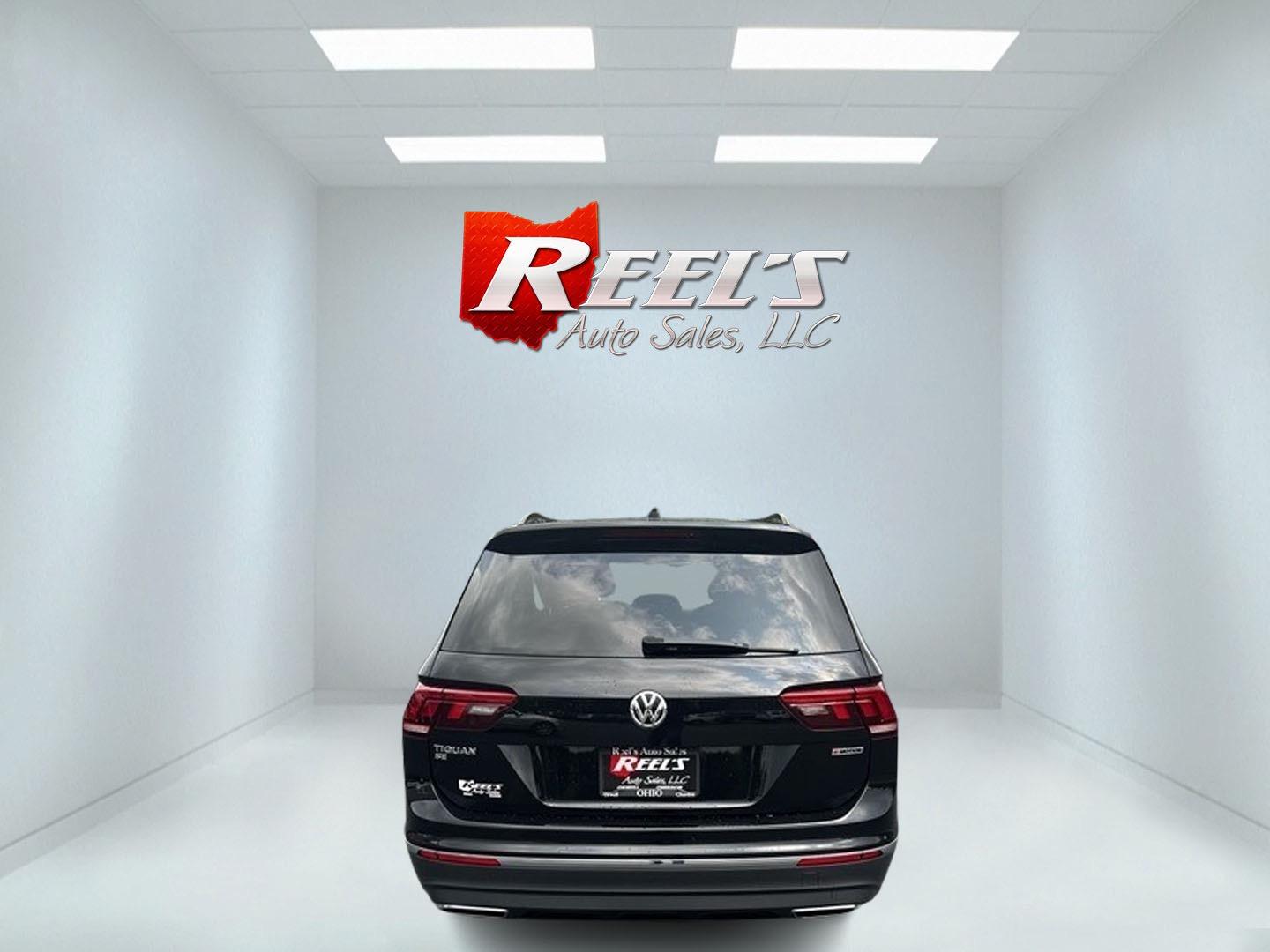 2021 Black /White Volkswagen Tiguan SE 4Motion AWD (3VV2B7AX6MM) with an 2.0L I4 DOHC 16V TURBO engine, 8A transmission, located at 11115 Chardon Rd. , Chardon, OH, 44024, (440) 214-9705, 41.580246, -81.241943 - This 2021 Volkswagen Tiguan SE 4Motion is a well-equipped compact SUV that combines performance, comfort, and advanced technology. It features a 2.0-liter turbocharged four-cylinder engine paired with an 8-speed automatic transmission and all-wheel drive system. This vehicle offers a luxurious inter - Photo#6