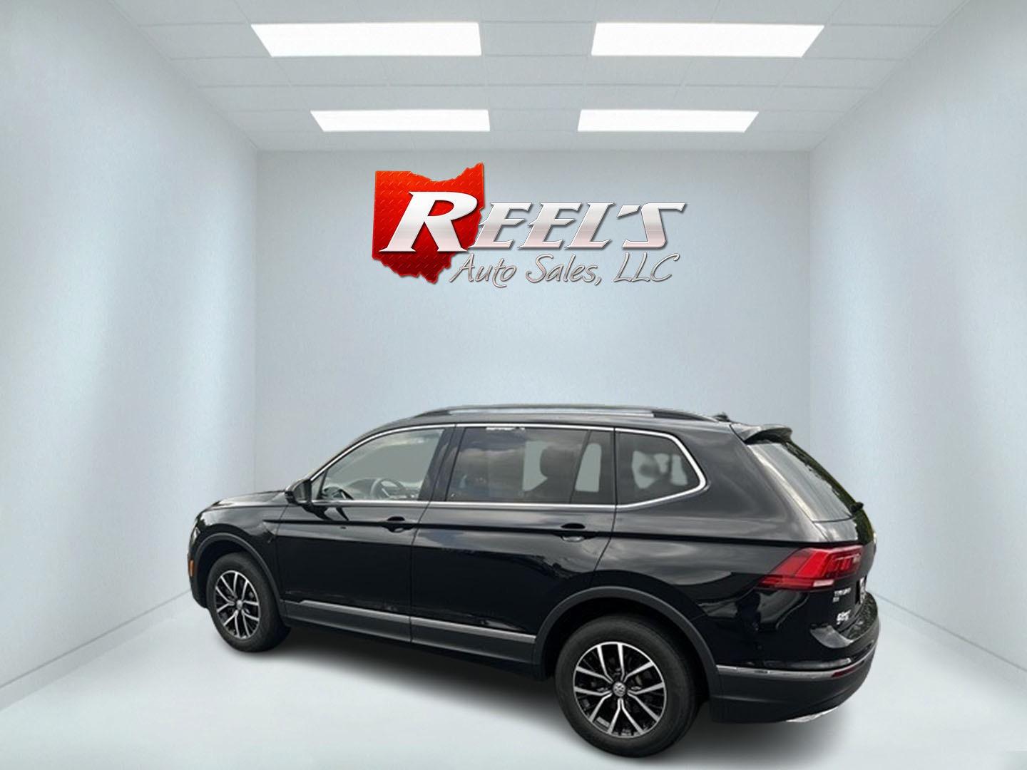 2021 Black /White Volkswagen Tiguan SE 4Motion AWD (3VV2B7AX6MM) with an 2.0L I4 DOHC 16V TURBO engine, 8A transmission, located at 11115 Chardon Rd. , Chardon, OH, 44024, (440) 214-9705, 41.580246, -81.241943 - This 2021 Volkswagen Tiguan SE 4Motion is a well-equipped compact SUV that combines performance, comfort, and advanced technology. It features a 2.0-liter turbocharged four-cylinder engine paired with an 8-speed automatic transmission and all-wheel drive system. This vehicle offers a luxurious inter - Photo#8