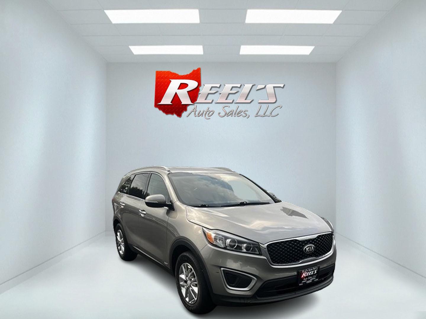 2016 Gray /Black Kia Sorento LX AWD (5XYPGDA39GG) with an 2.4L I4 DOHC 16V engine, 6-Speed Automatic transmission, located at 547 E. Main St., Orwell, OH, 44076, (440) 437-5893, 41.535435, -80.847855 - This 2016 Kia Sorento LX AWD is a practical and capable midsize SUV that offers a balance of comfort and utility. It's powered by a 2.4-liter GDI four-cylinder engine paired with a 6-speed automatic transmission and all-wheel drive system. This vehicle features a lockable center differential and sel - Photo#2