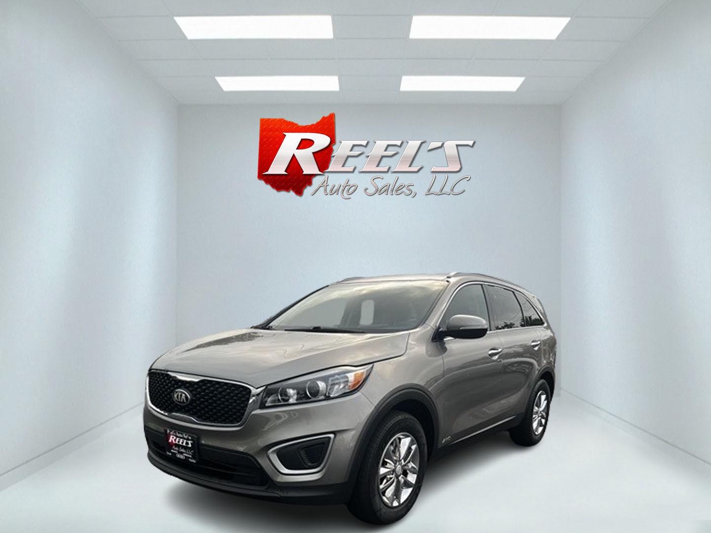 2016 Gray /Black Kia Sorento LX AWD (5XYPGDA39GG) with an 2.4L I4 DOHC 16V engine, 6-Speed Automatic transmission, located at 547 E. Main St., Orwell, OH, 44076, (440) 437-5893, 41.535435, -80.847855 - This 2016 Kia Sorento LX AWD is a practical and capable midsize SUV that offers a balance of comfort and utility. It's powered by a 2.4-liter GDI four-cylinder engine paired with a 6-speed automatic transmission and all-wheel drive system. This vehicle features a lockable center differential and sel - Photo#0