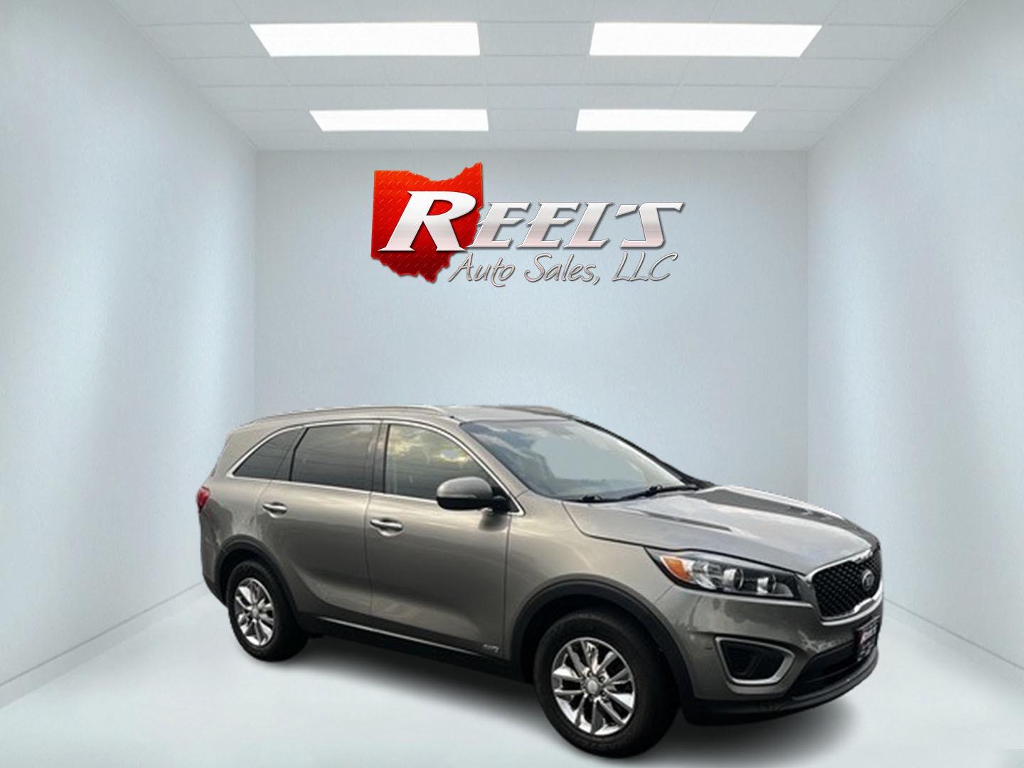 2016 Gray /Black Kia Sorento LX AWD (5XYPGDA39GG) with an 2.4L I4 DOHC 16V engine, 6-Speed Automatic transmission, located at 547 E. Main St., Orwell, OH, 44076, (440) 437-5893, 41.535435, -80.847855 - This 2016 Kia Sorento LX AWD is a practical and capable midsize SUV that offers a balance of comfort and utility. It's powered by a 2.4-liter GDI four-cylinder engine paired with a 6-speed automatic transmission and all-wheel drive system. This vehicle features a lockable center differential and sel - Photo#3